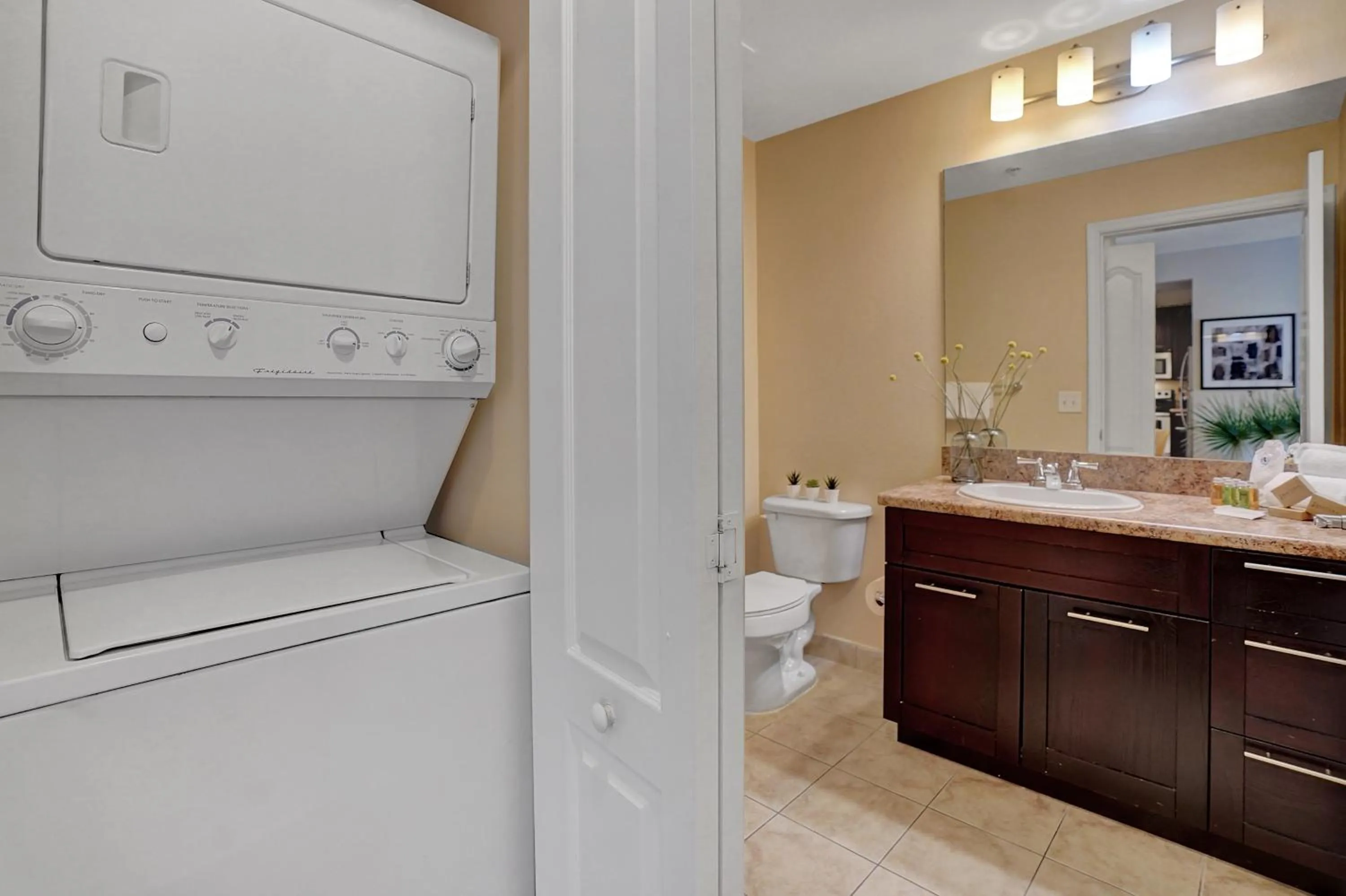 washing machine in Dharma Home Suites South Miami at Red Road Commons