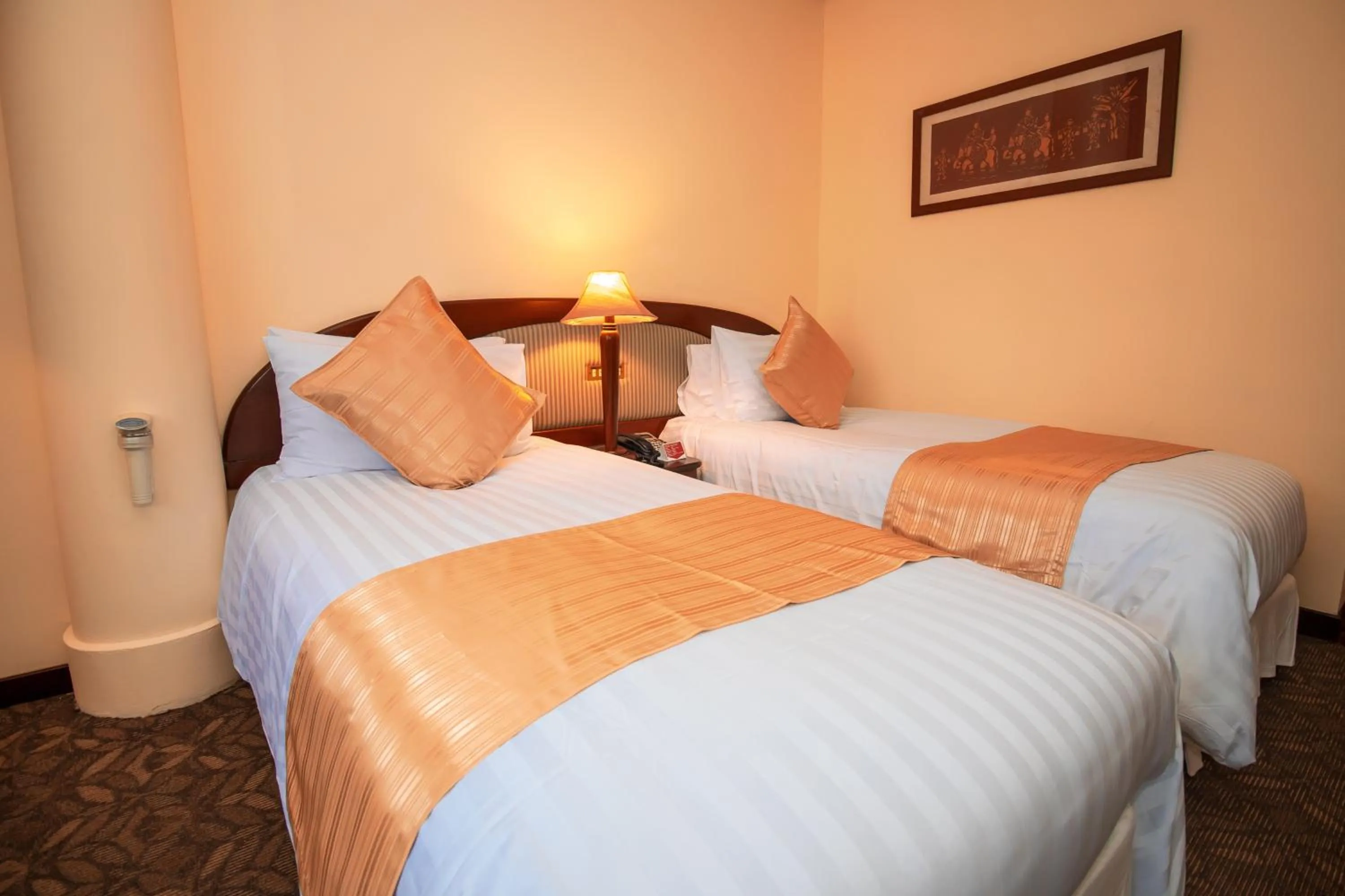 Bed in LAOTEL VIENTIANE