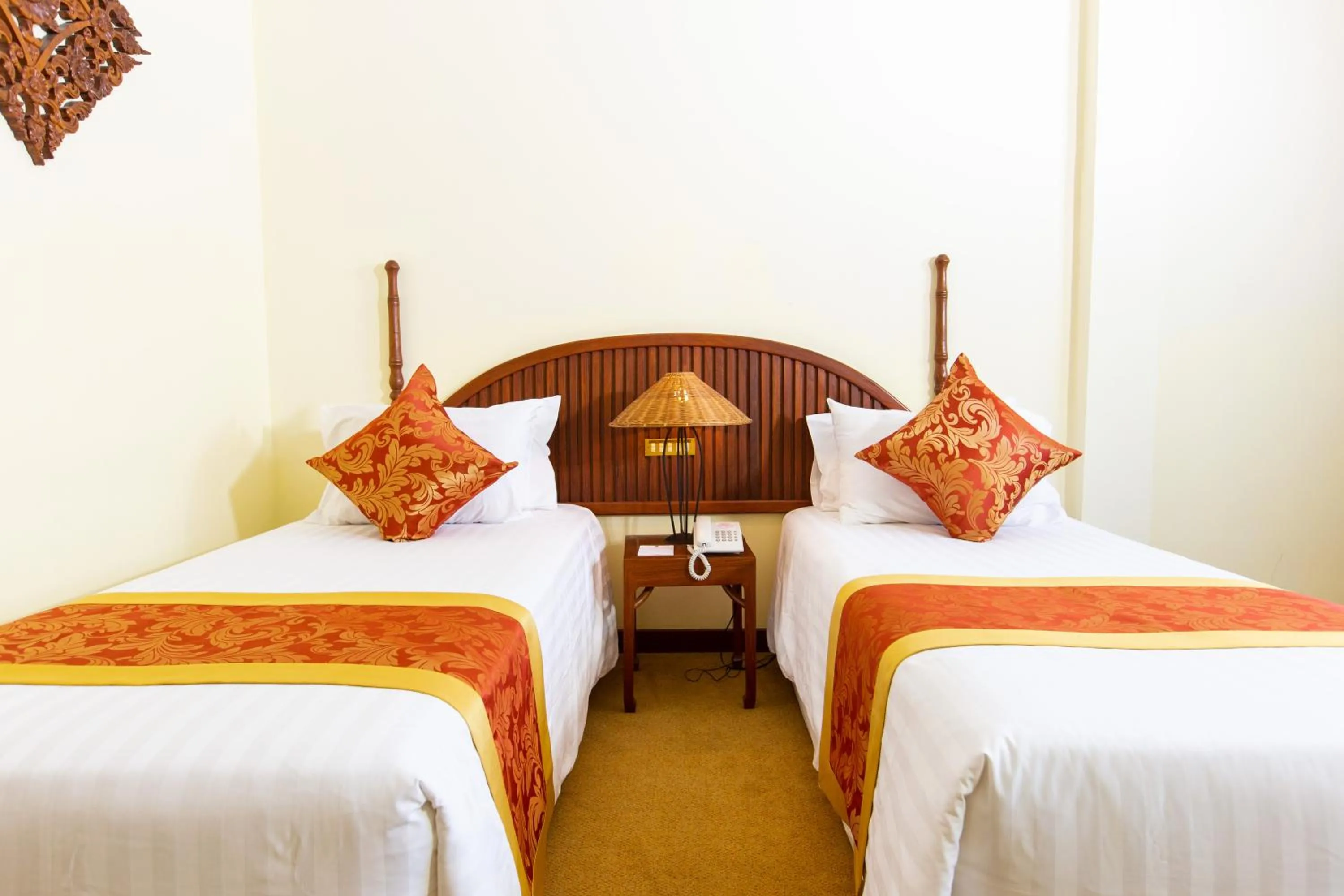 Bed in LAOTEL VIENTIANE