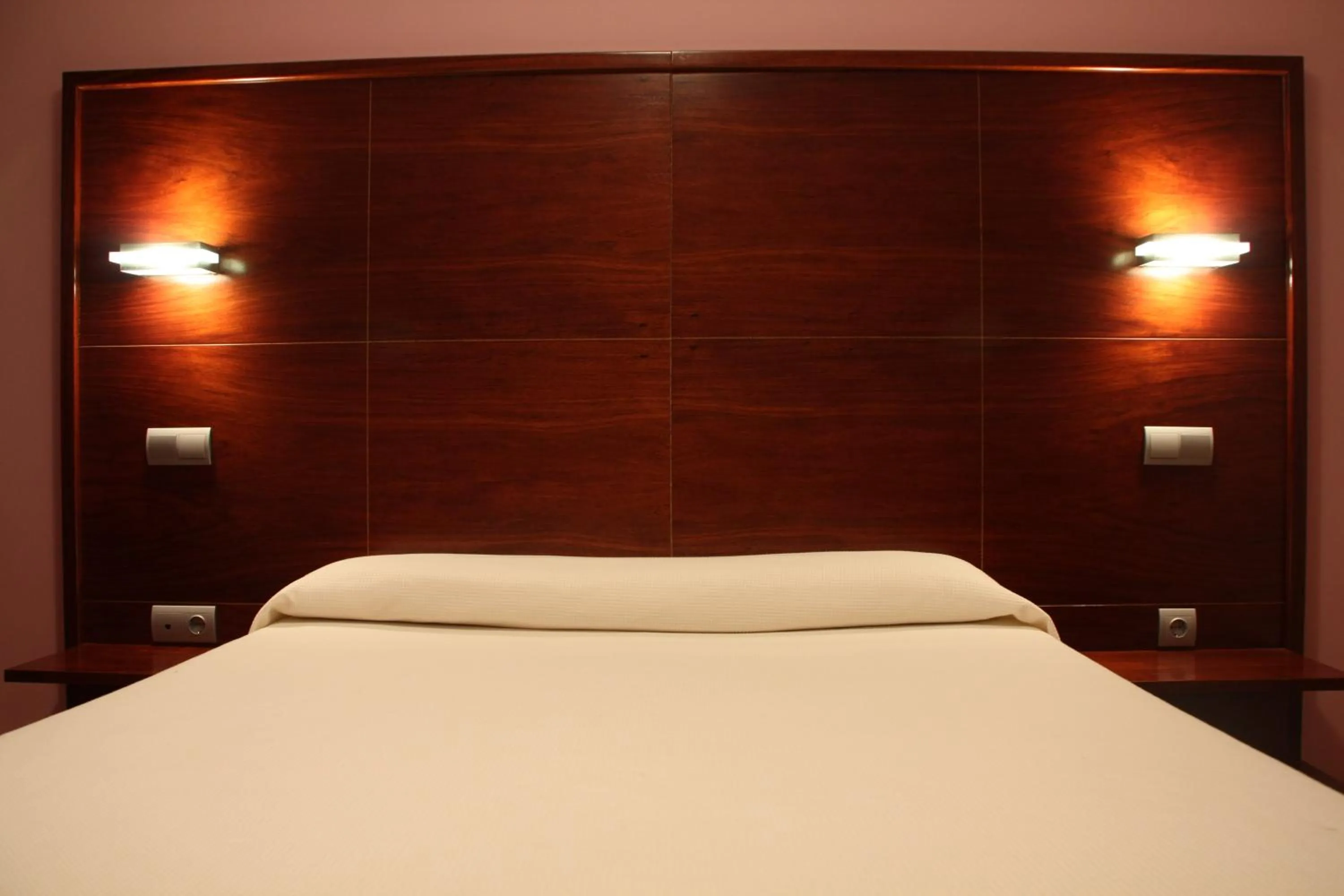 Bed in Hotel Tremazal