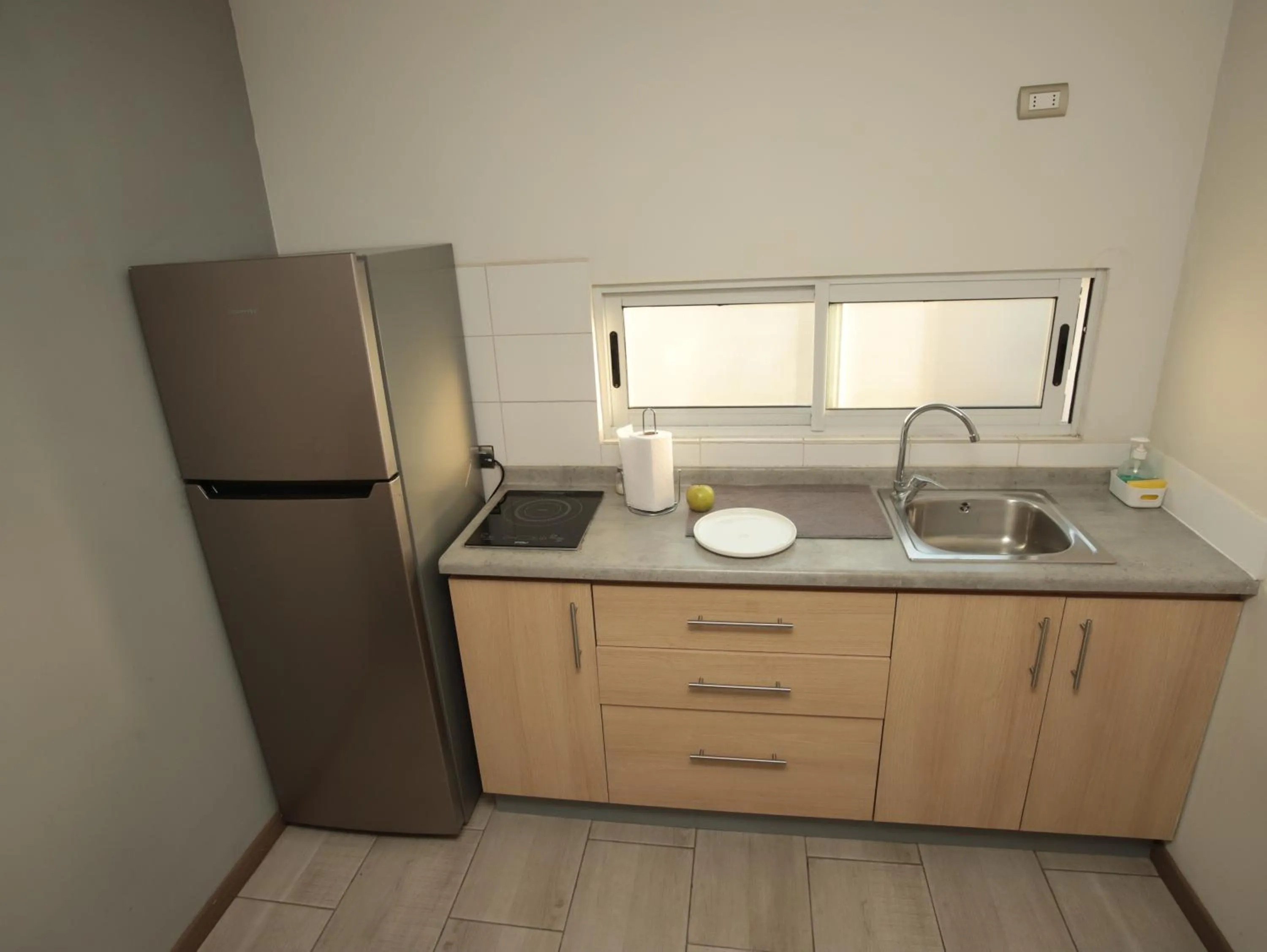 Kitchen or kitchenette in De Triana Hotel