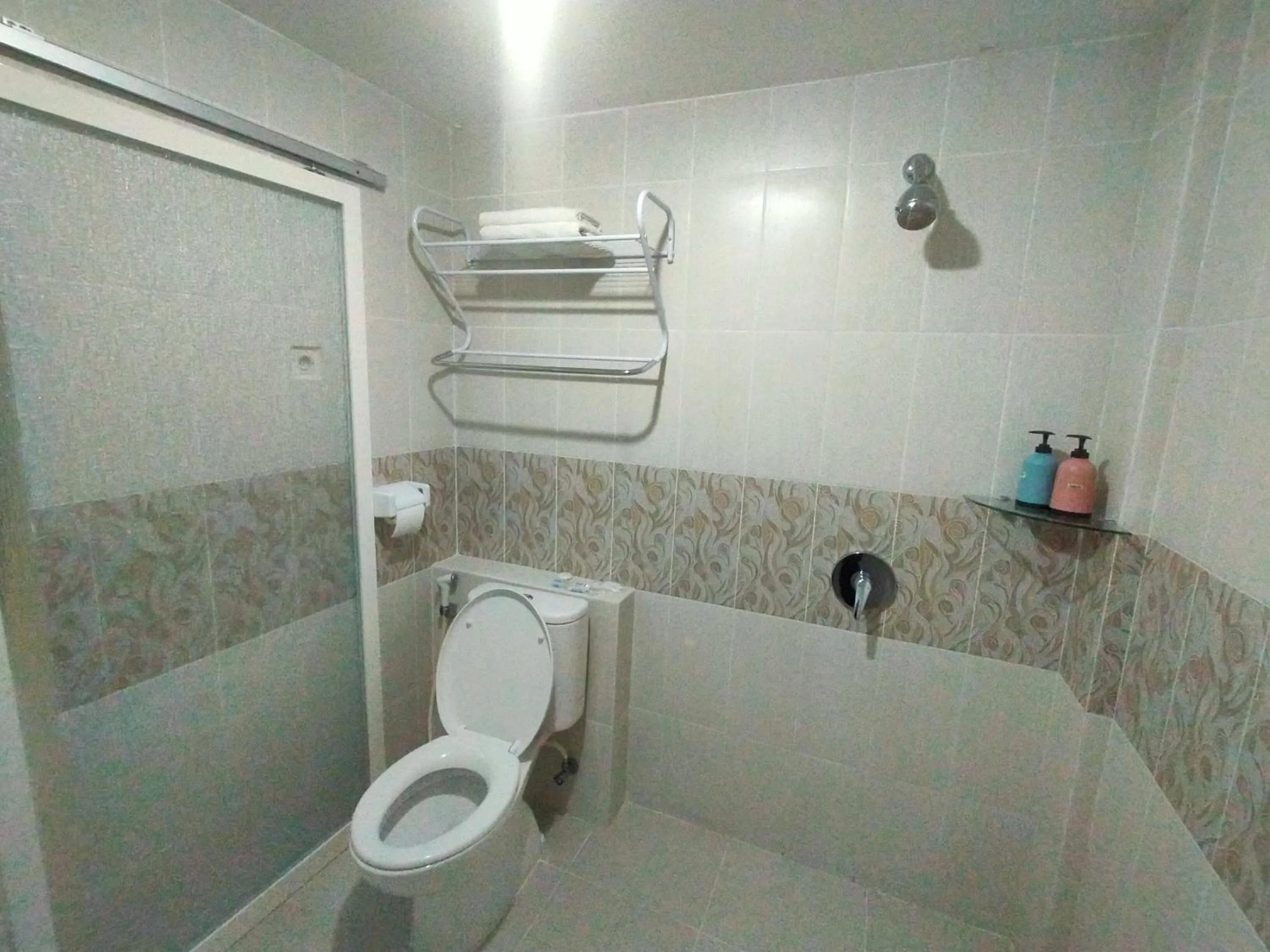 Bathroom in GRANADA INN PALU