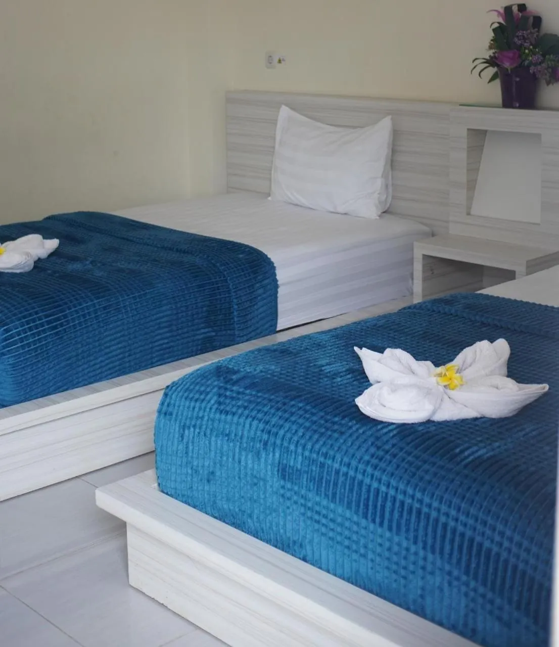 Bed in GRANADA INN PALU