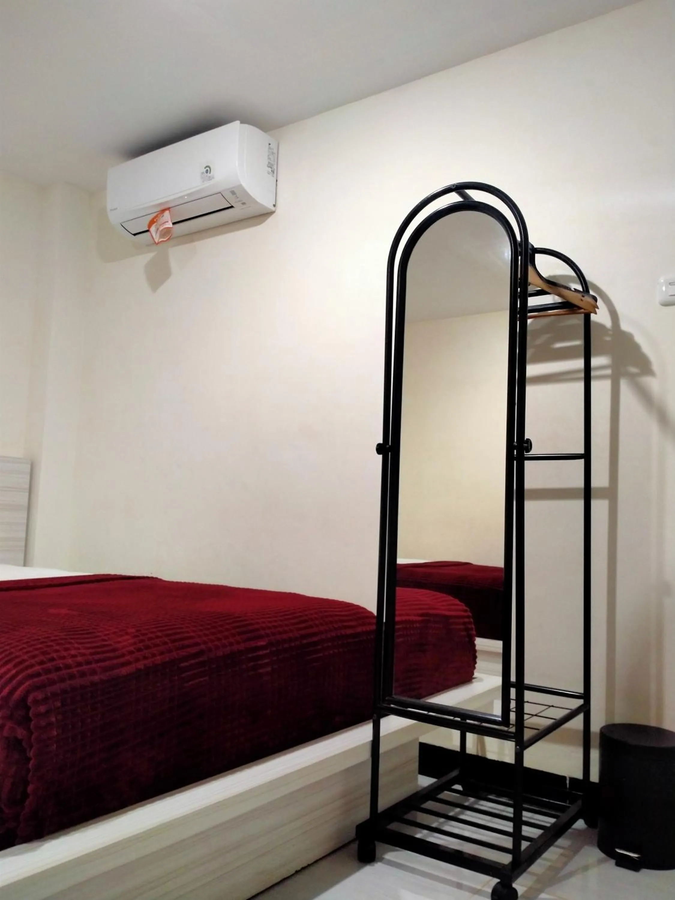 Bed in GRANADA INN PALU