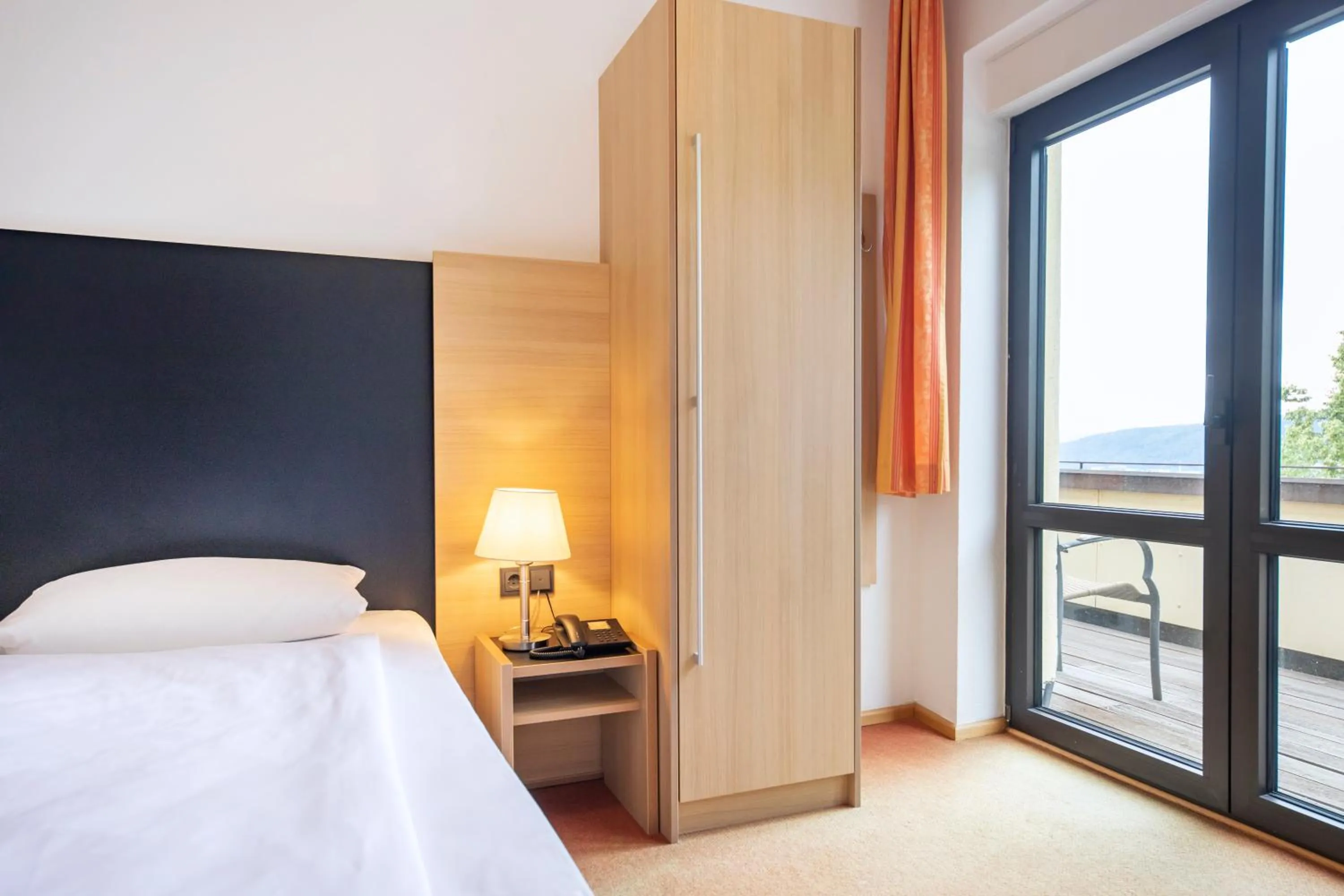 Photo of the whole room, Bed in Hotel Franziskushöhe Lohr