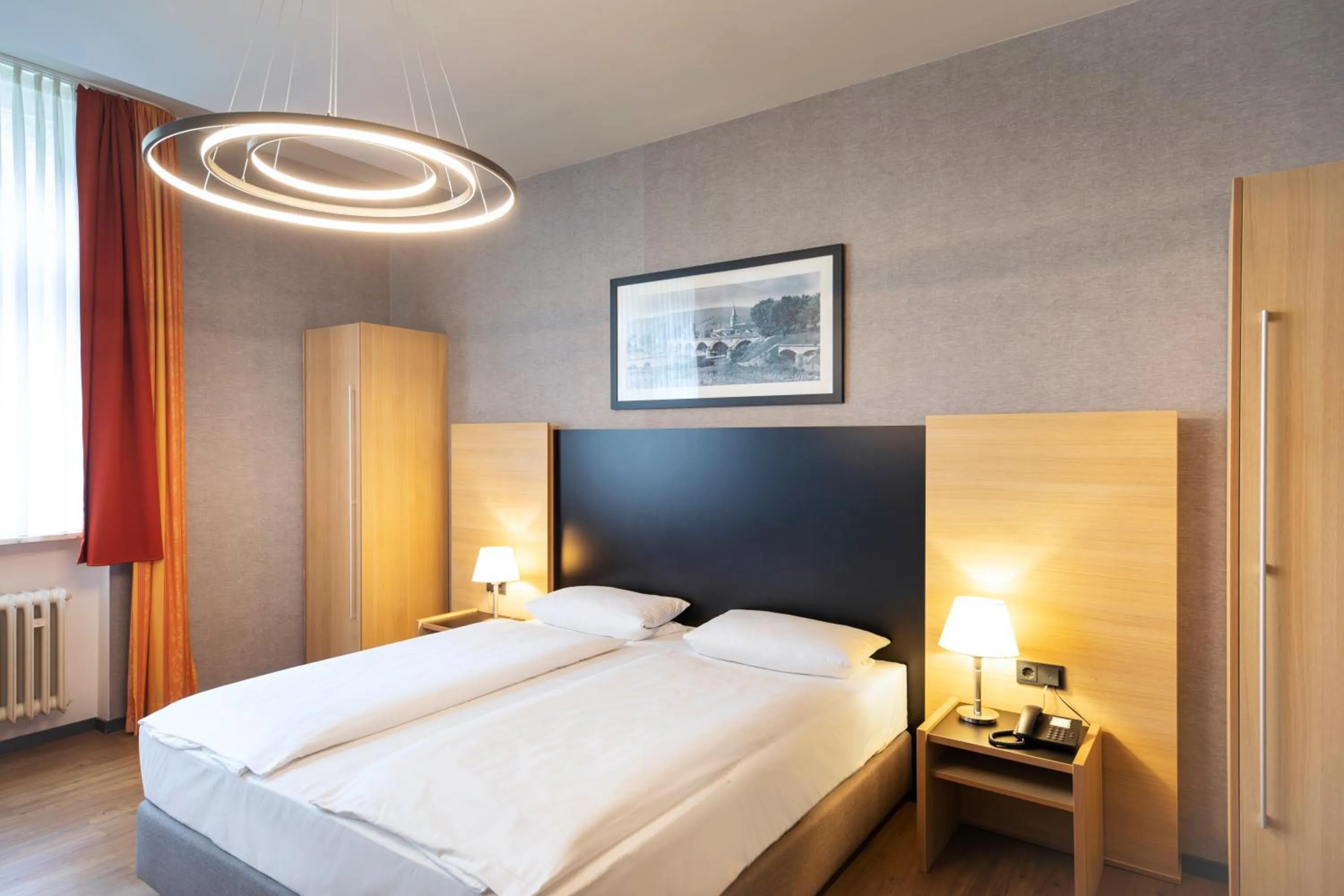 Photo of the whole room, Bed in Hotel Franziskushöhe Lohr