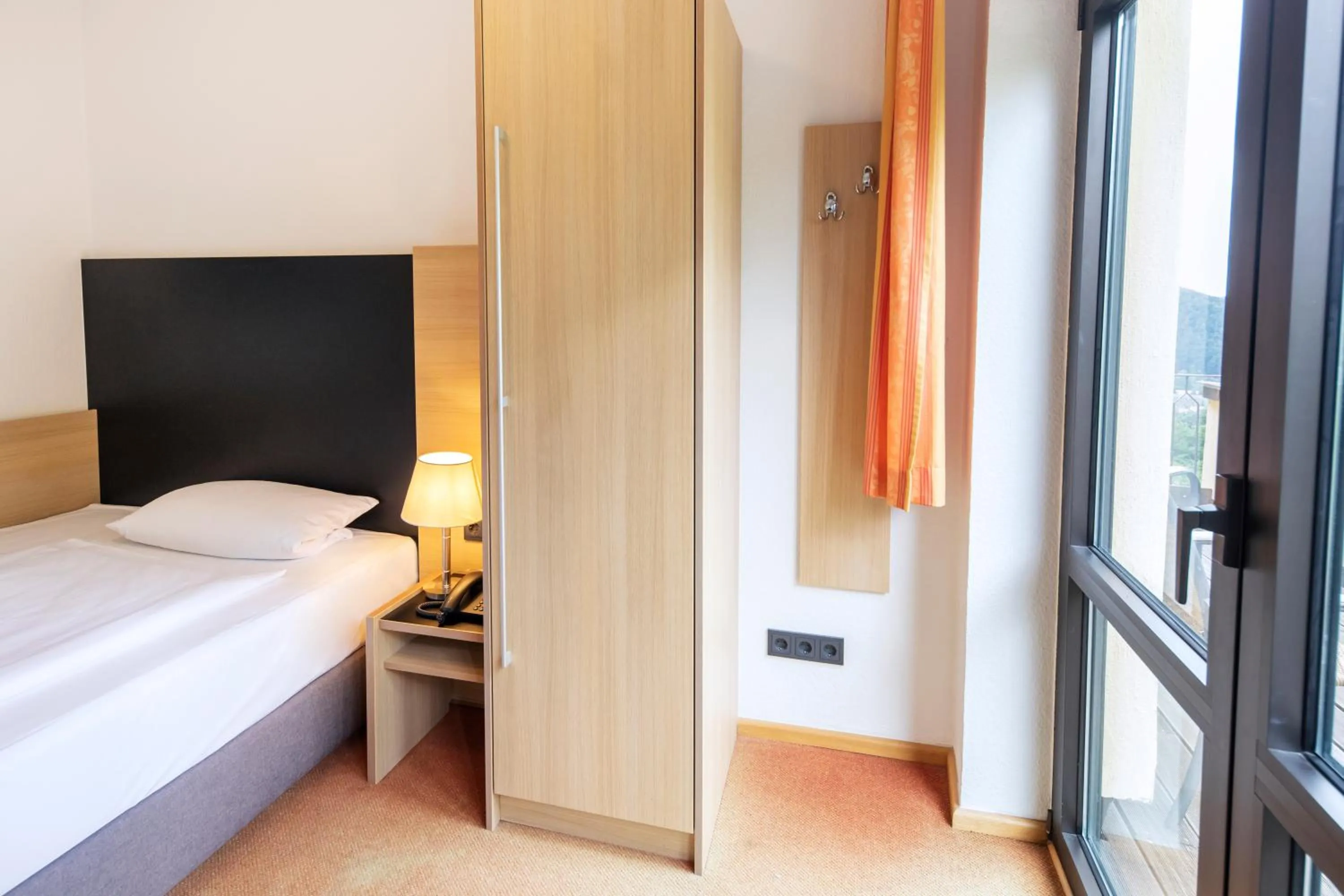 Photo of the whole room, Bed in Hotel Franziskushöhe Lohr