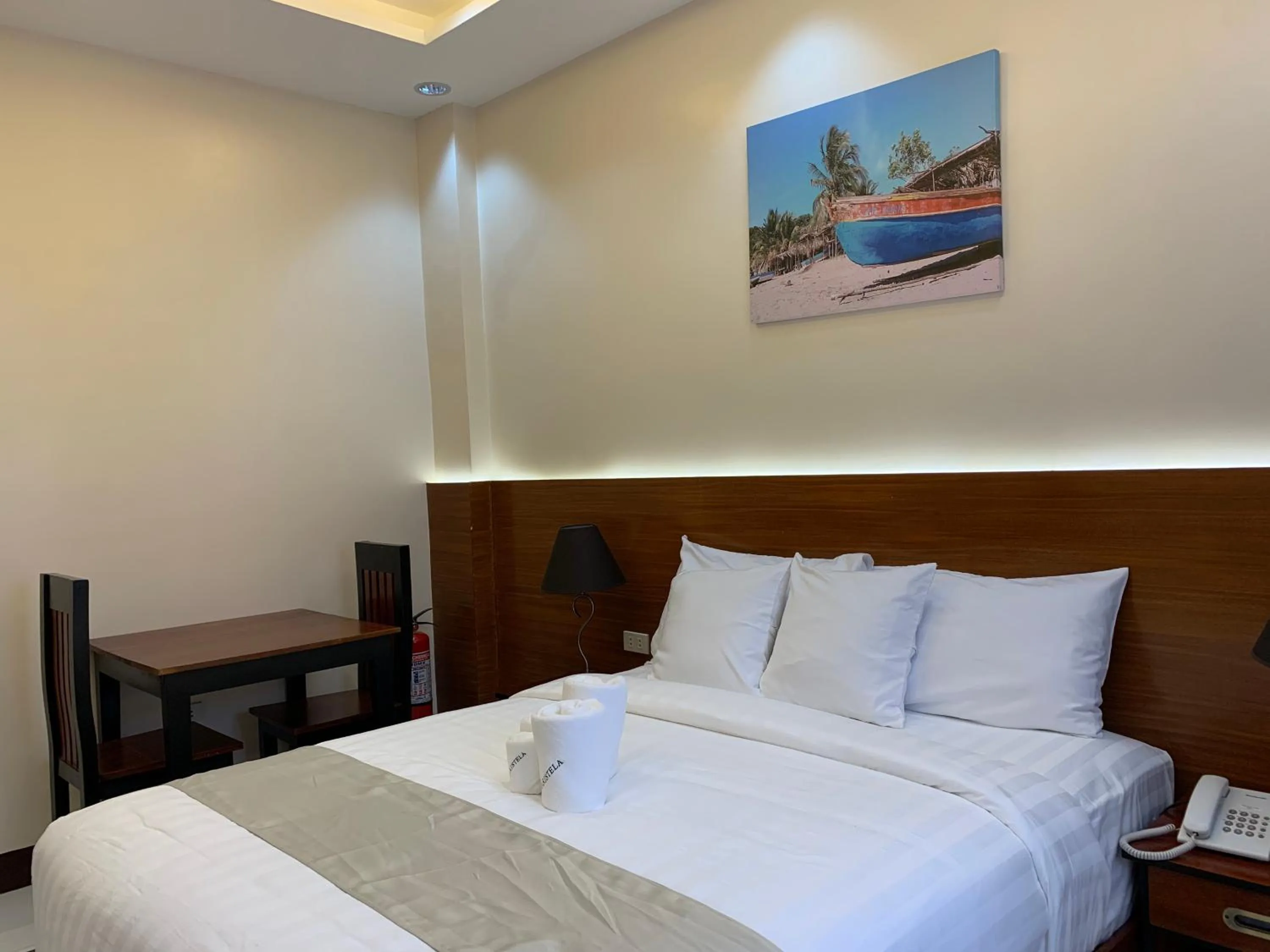Bed in Villa MJ Maristela Beach Resort