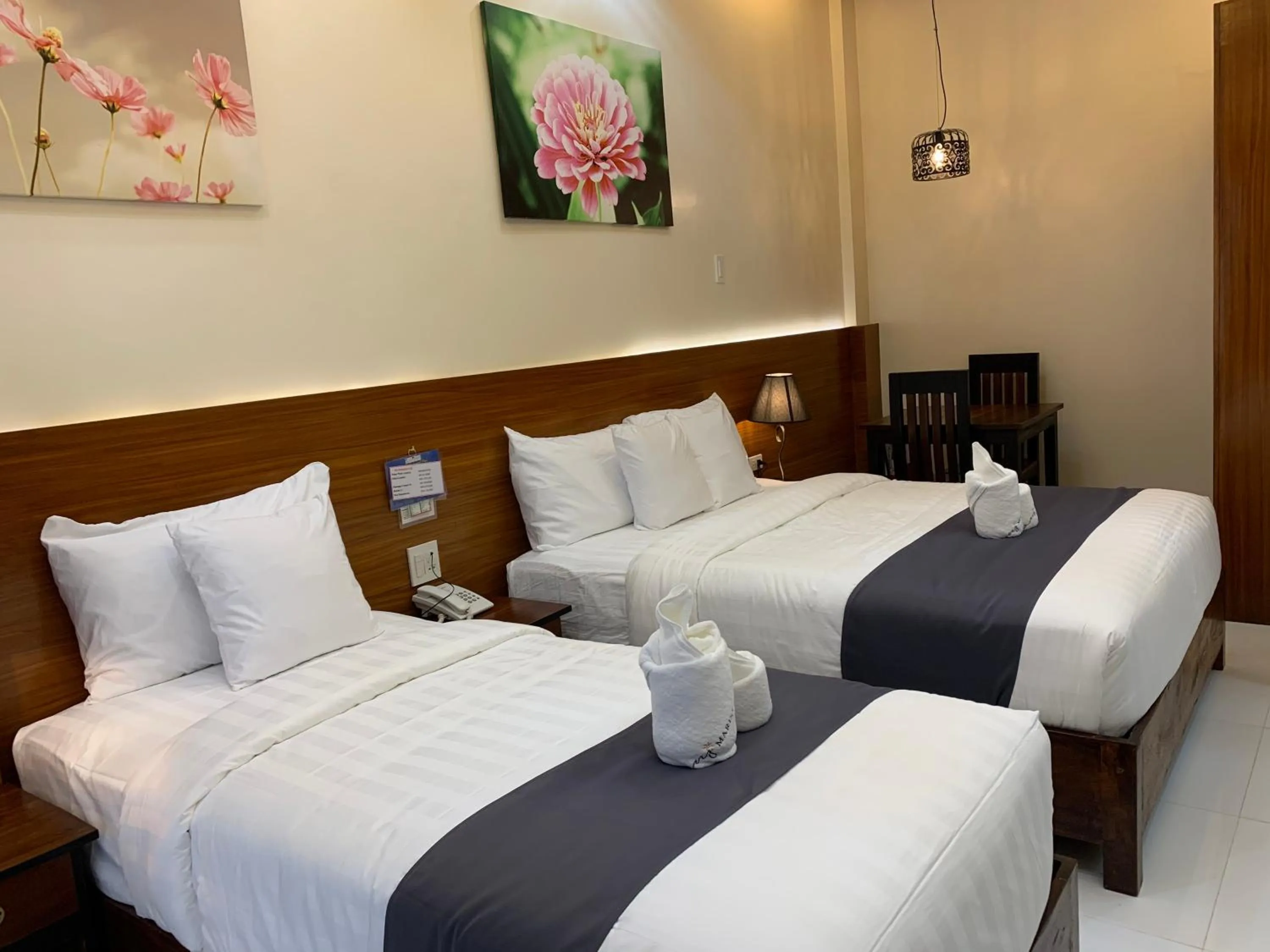 Bed in Villa MJ Maristela Beach Resort