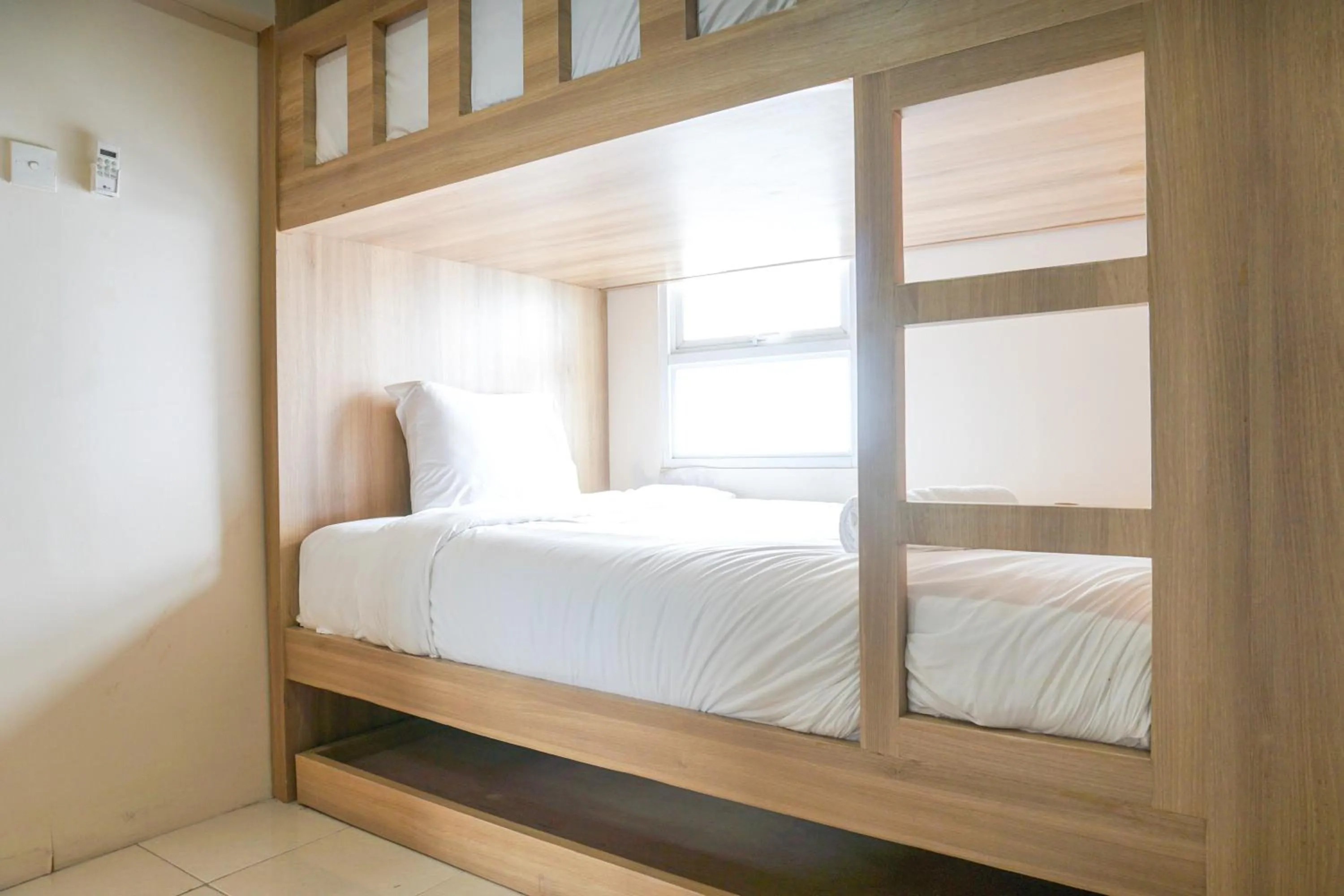 Bedroom, Bed in Comfortable 3BR Apartment at Green Palm Residences By Travelio