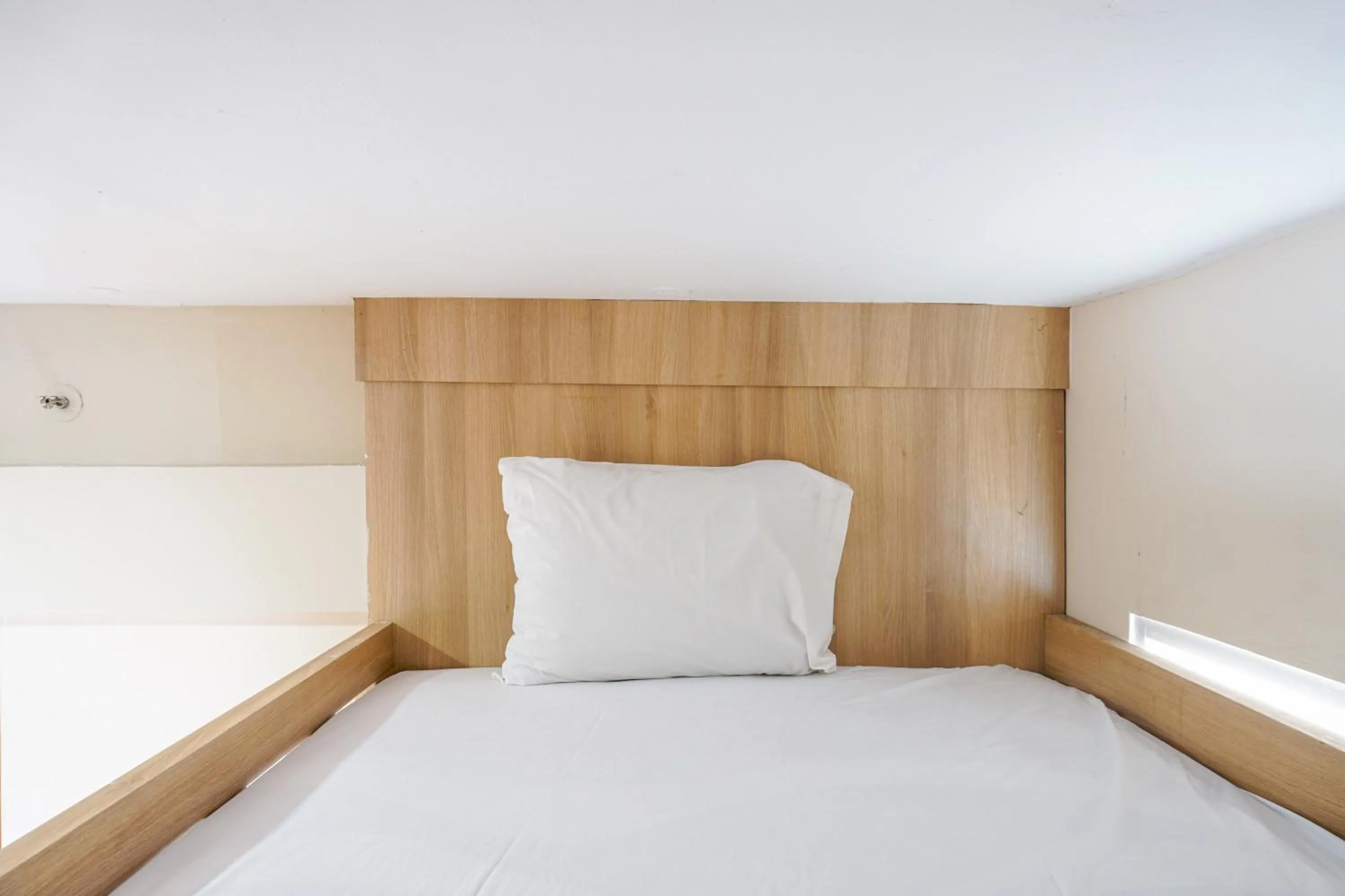 Bed in Comfortable 3BR Apartment at Green Palm Residences By Travelio