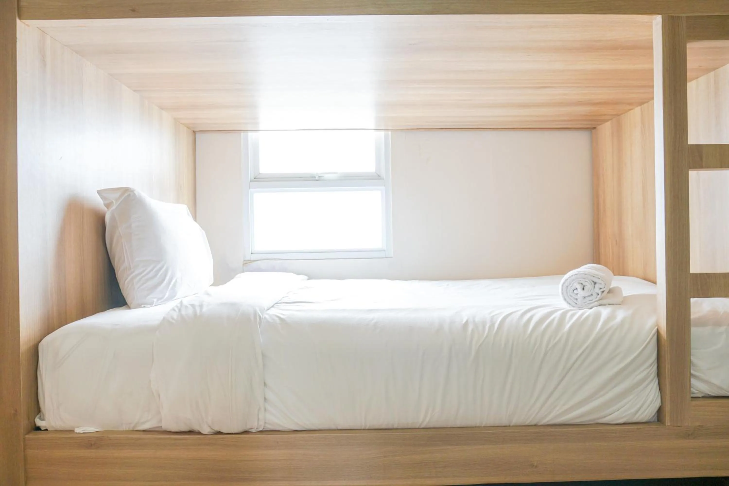 Bed in Comfortable 3BR Apartment at Green Palm Residences By Travelio