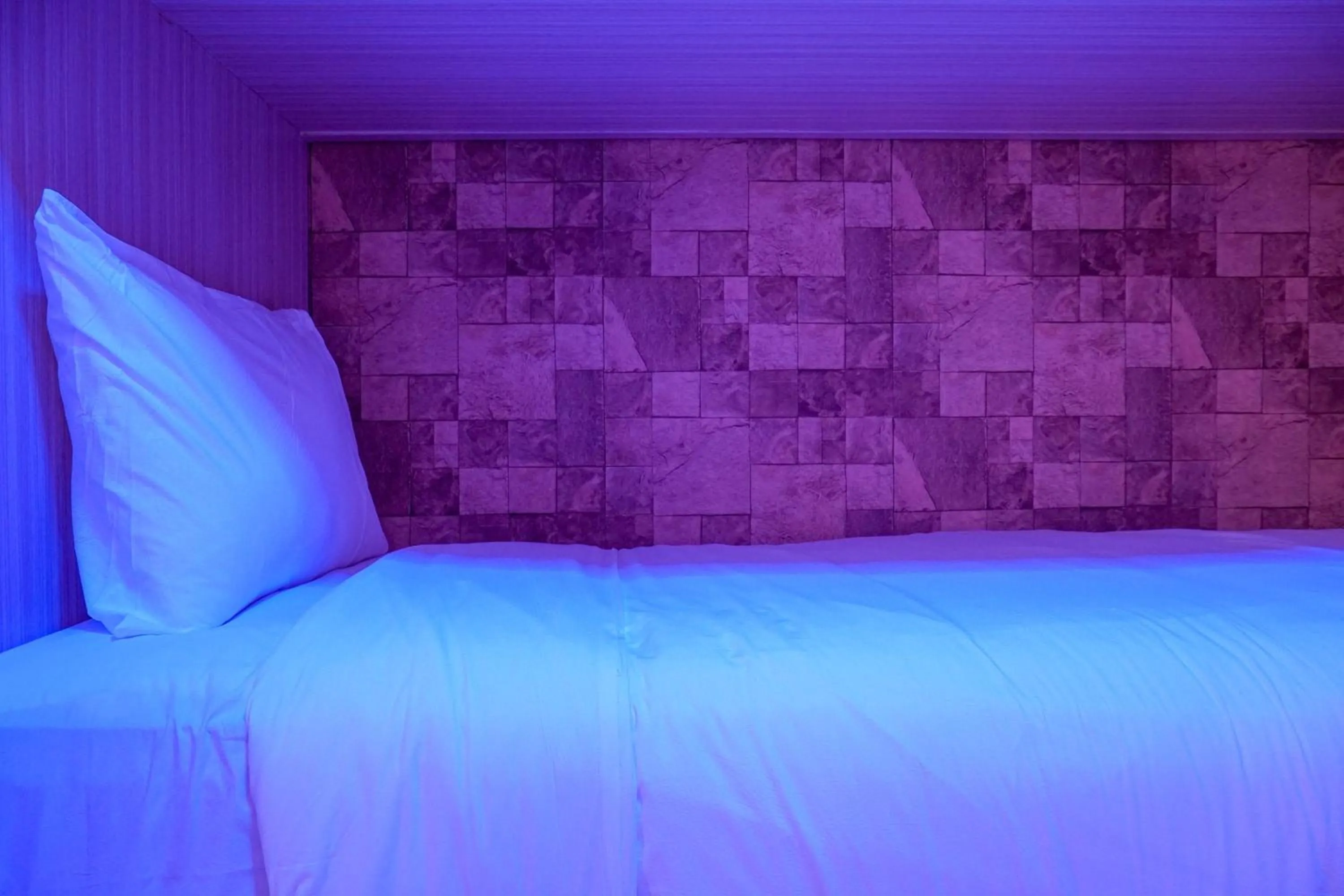 Bed in Comfortable 3BR Apartment at Green Palm Residences By Travelio