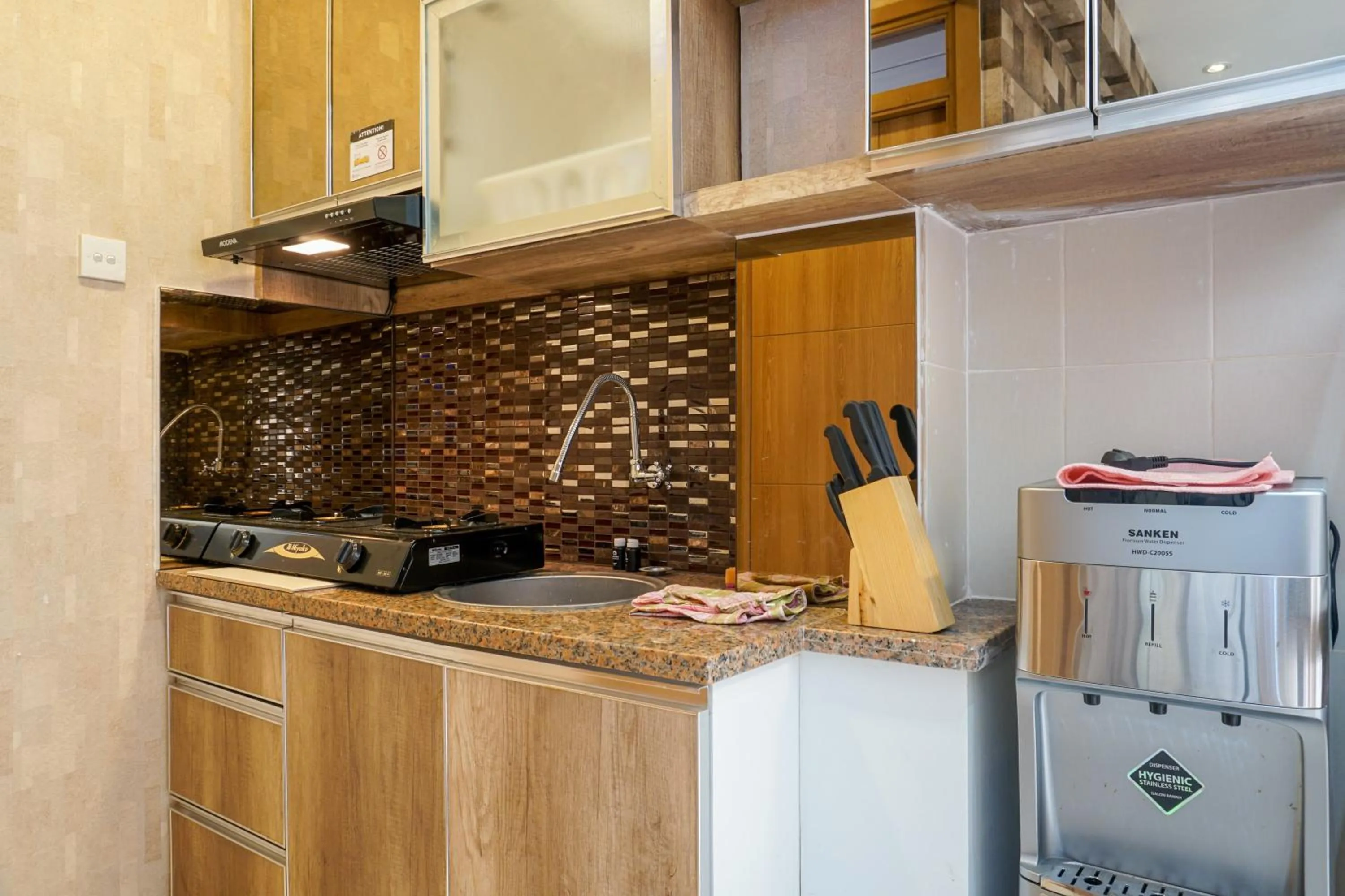 Kitchen or kitchenette in Comfortable 3BR Apartment at Green Palm Residences By Travelio