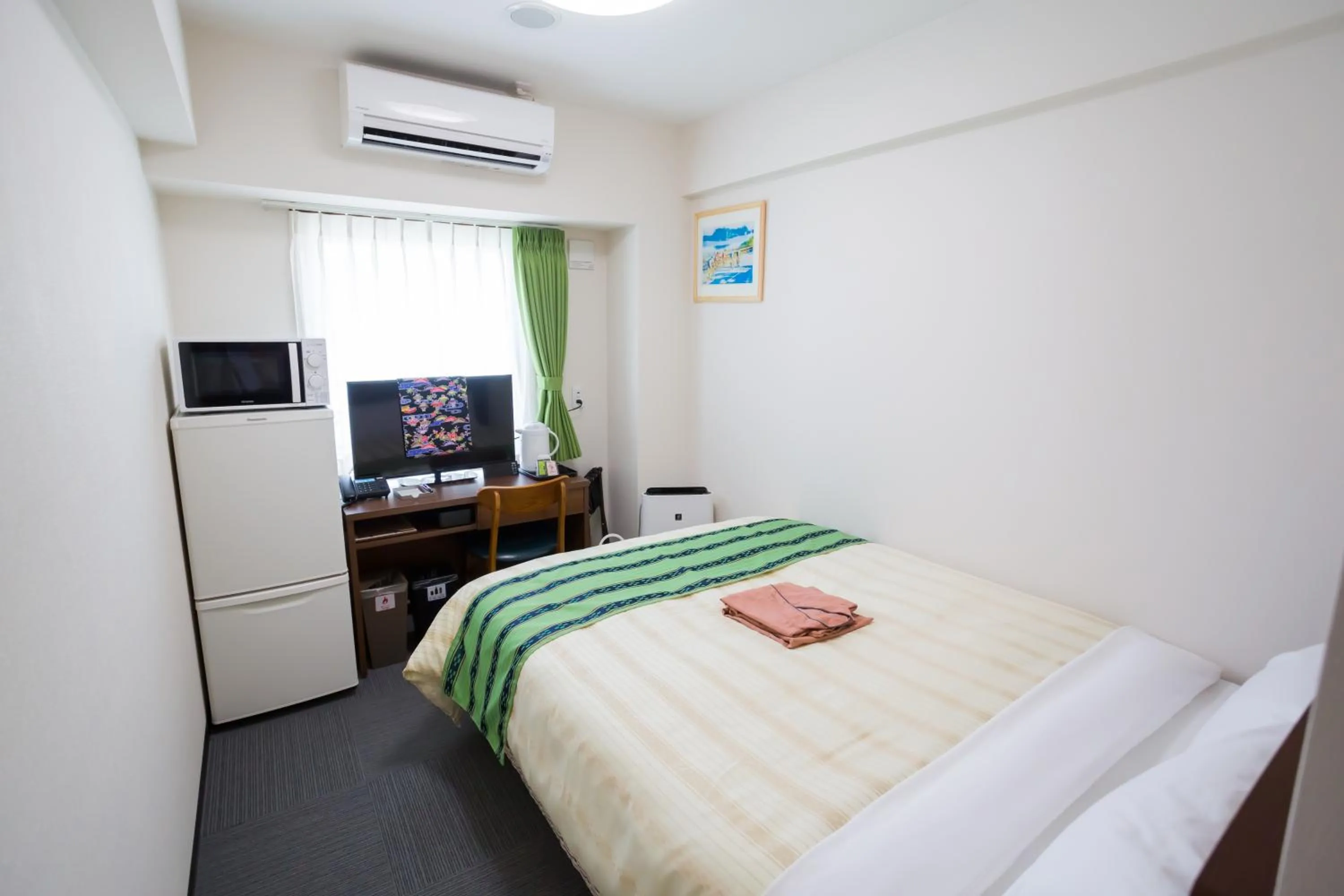 Bed in Hotel Peace Island Nago