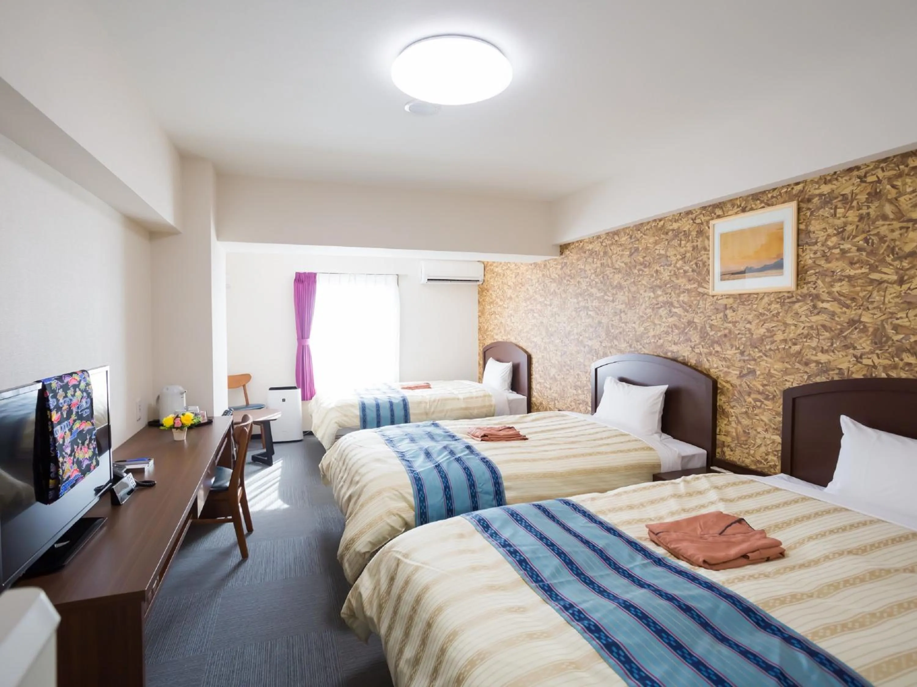 Bed in Hotel Peace Island Nago