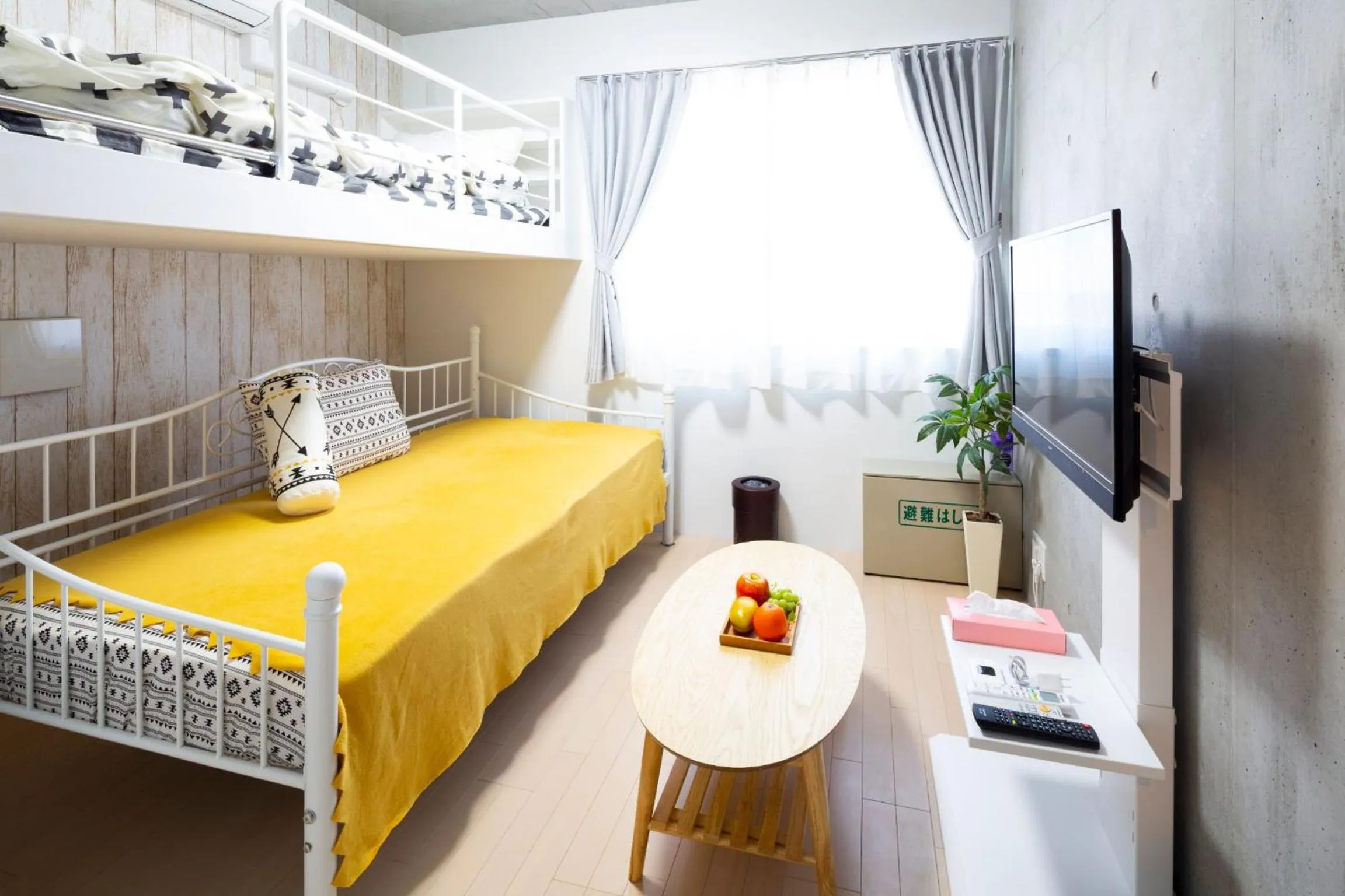 Bed in Laffitte Hirai Condominium Hotel