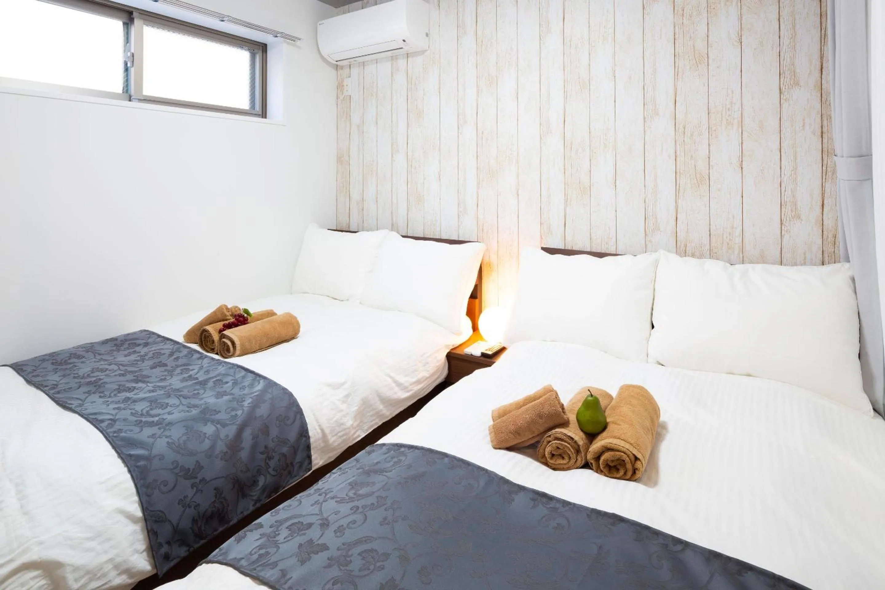 Bed in Laffitte Hirai Condominium Hotel