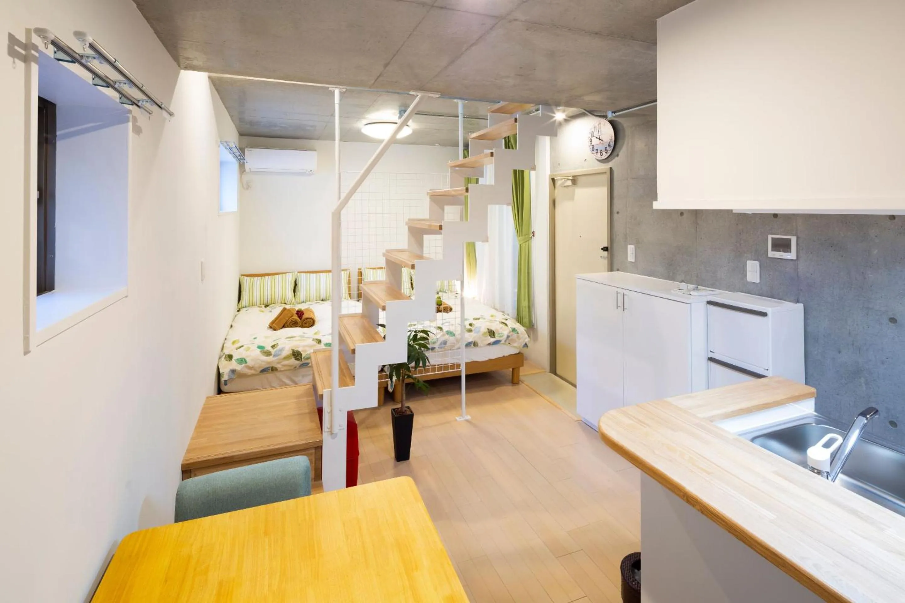 Bed in Laffitte Hirai Condominium Hotel