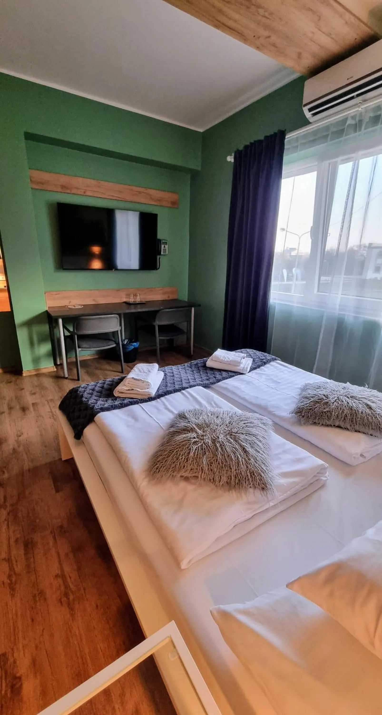 Communal lounge/ TV room, Bed in Boutique Hotel & Event Center