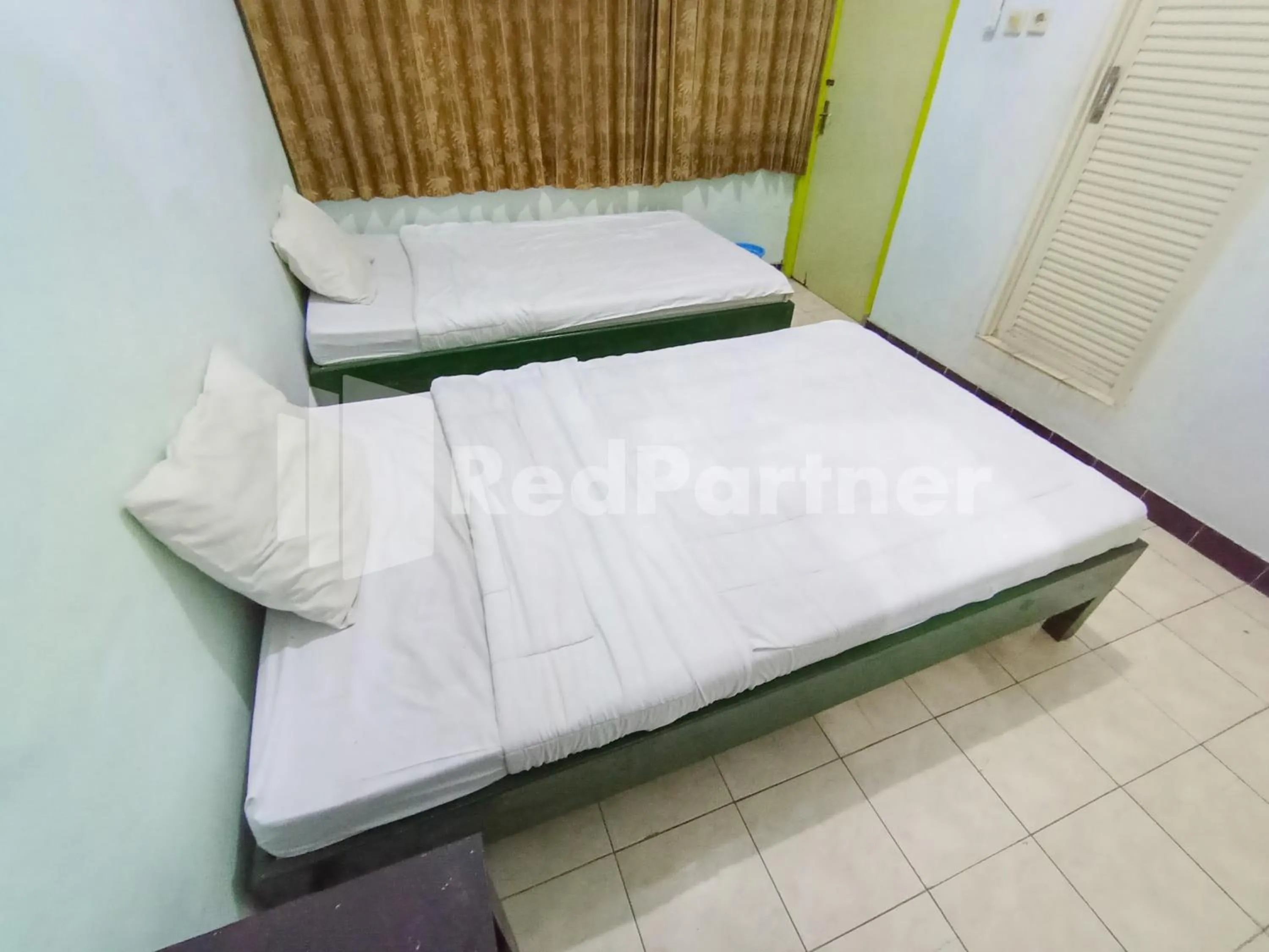 Bedroom, Bed in Orange inn RedPartner Madiun