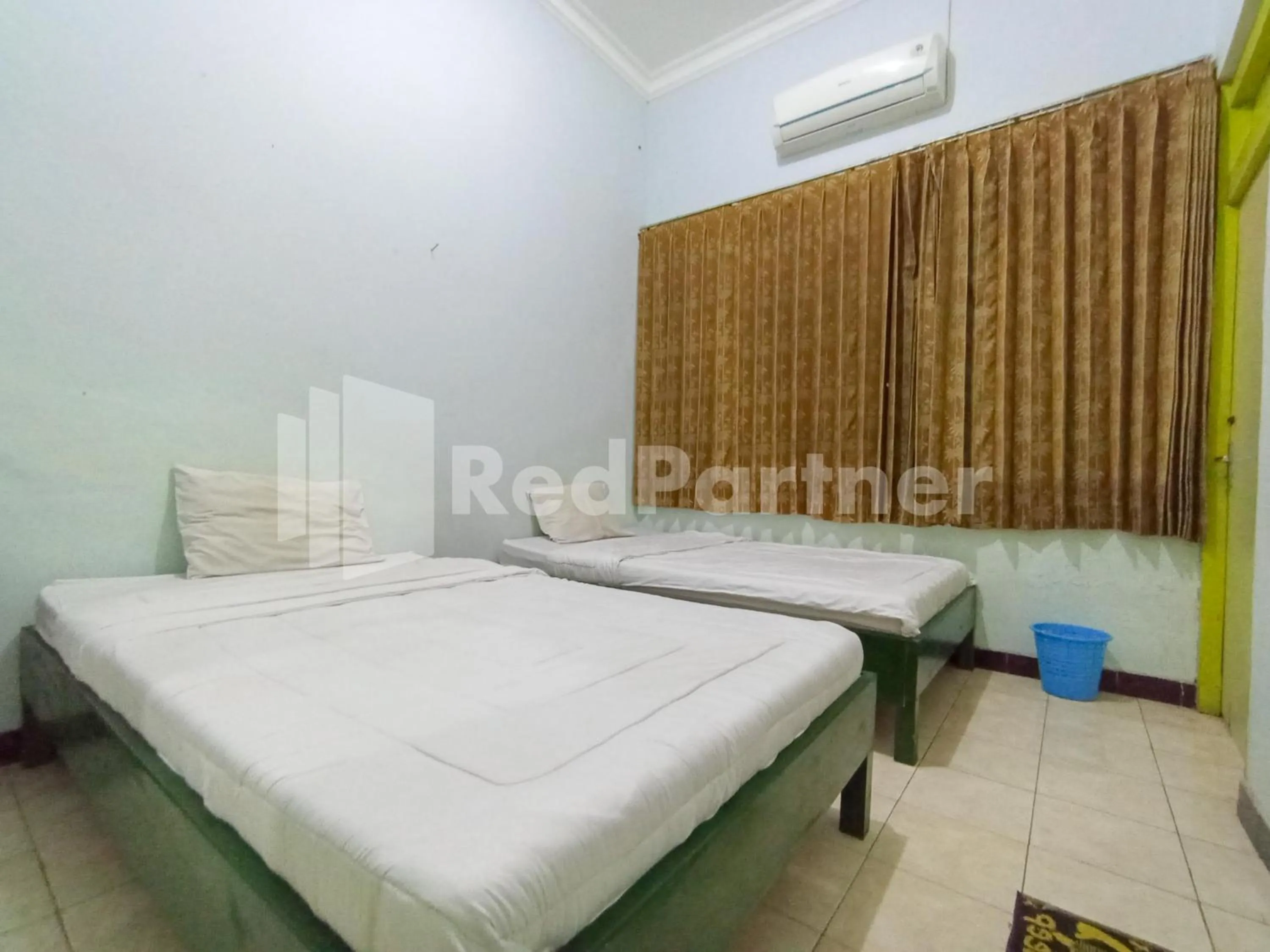 Bedroom, Bed in Orange inn RedPartner Madiun