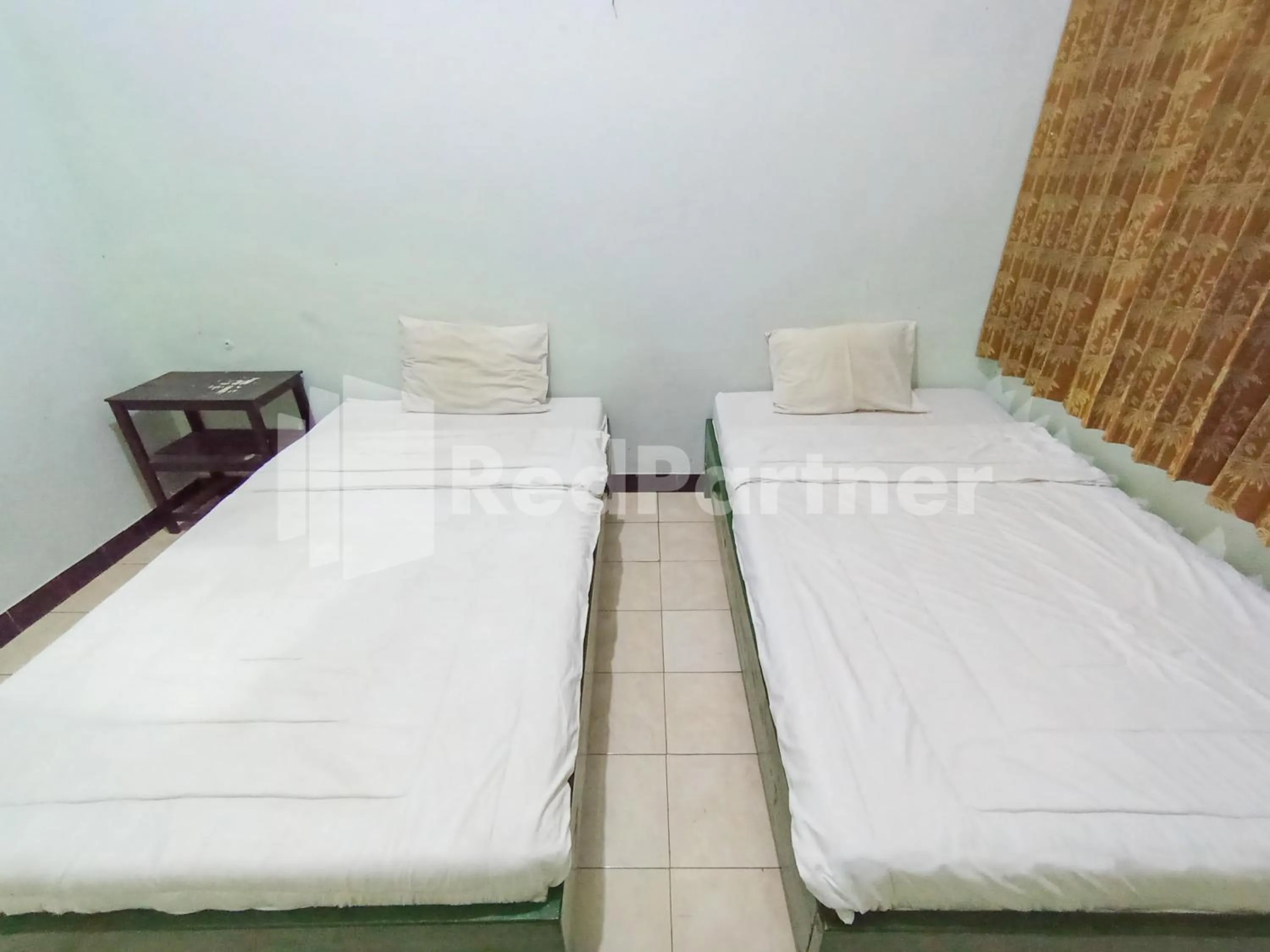 Bedroom, Bed in Orange inn RedPartner Madiun