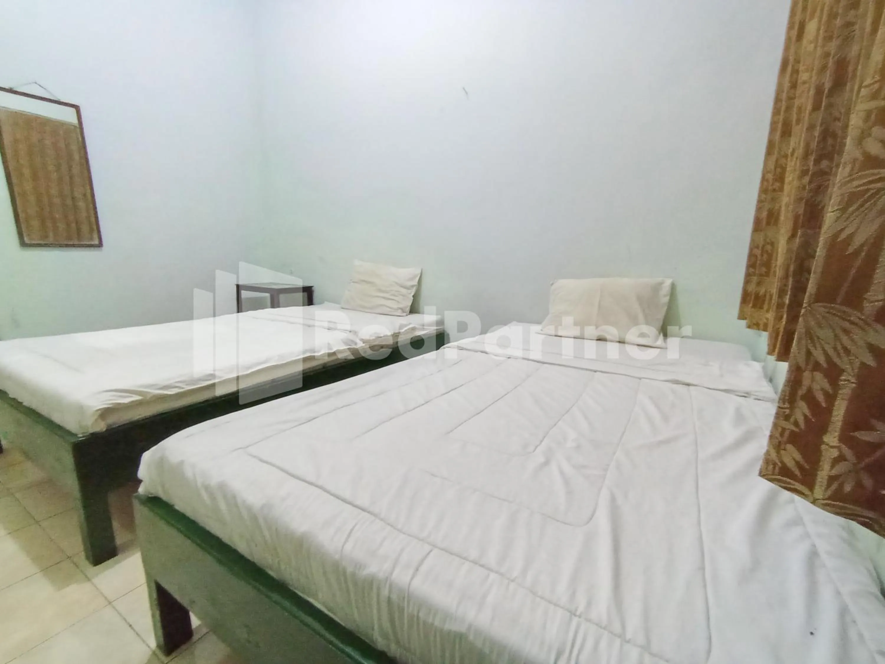 Bedroom, Bed in Orange inn RedPartner Madiun
