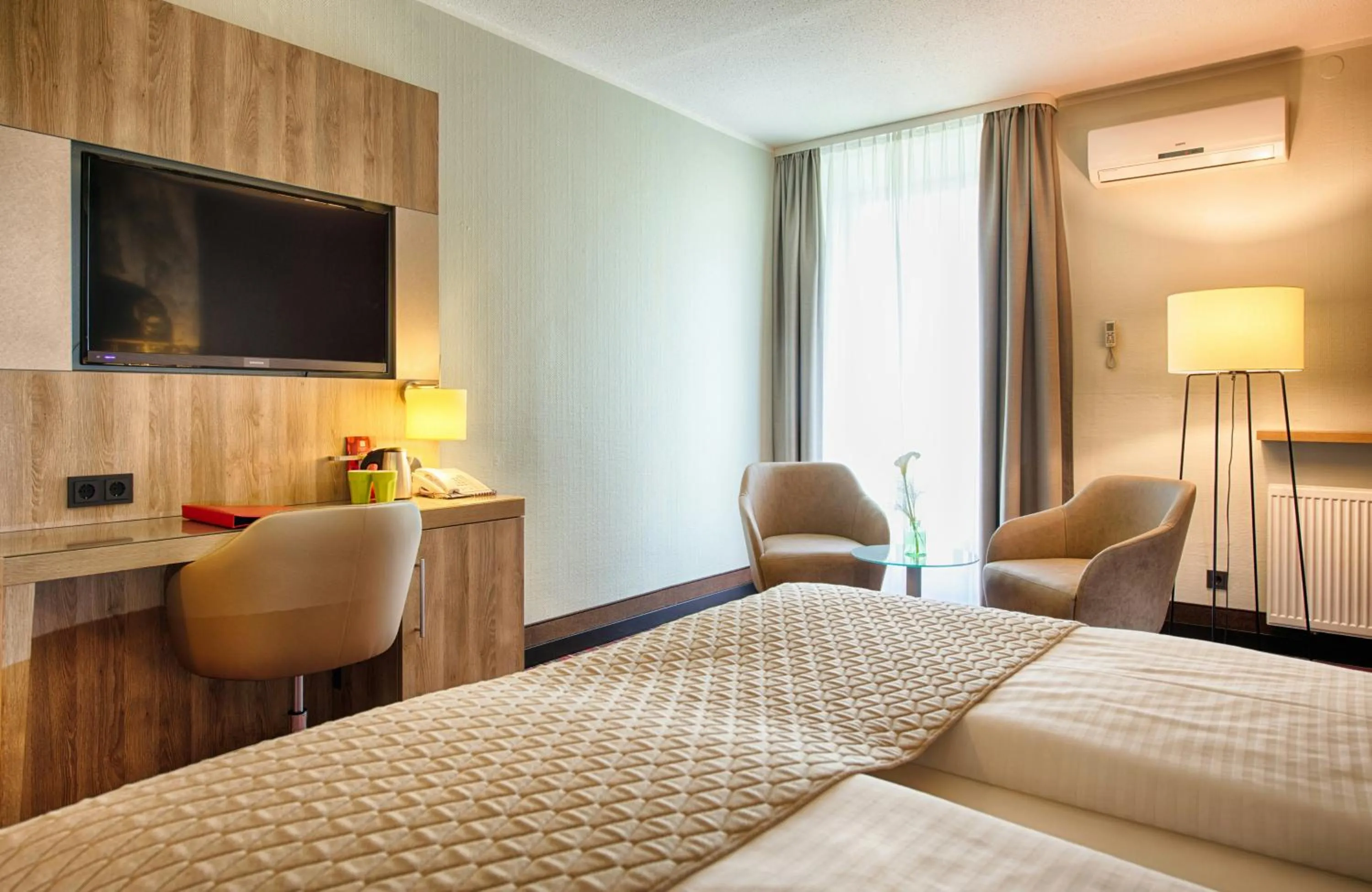 Photo of the whole room, Bed in Leonardo Hotel Wolfsburg City Center