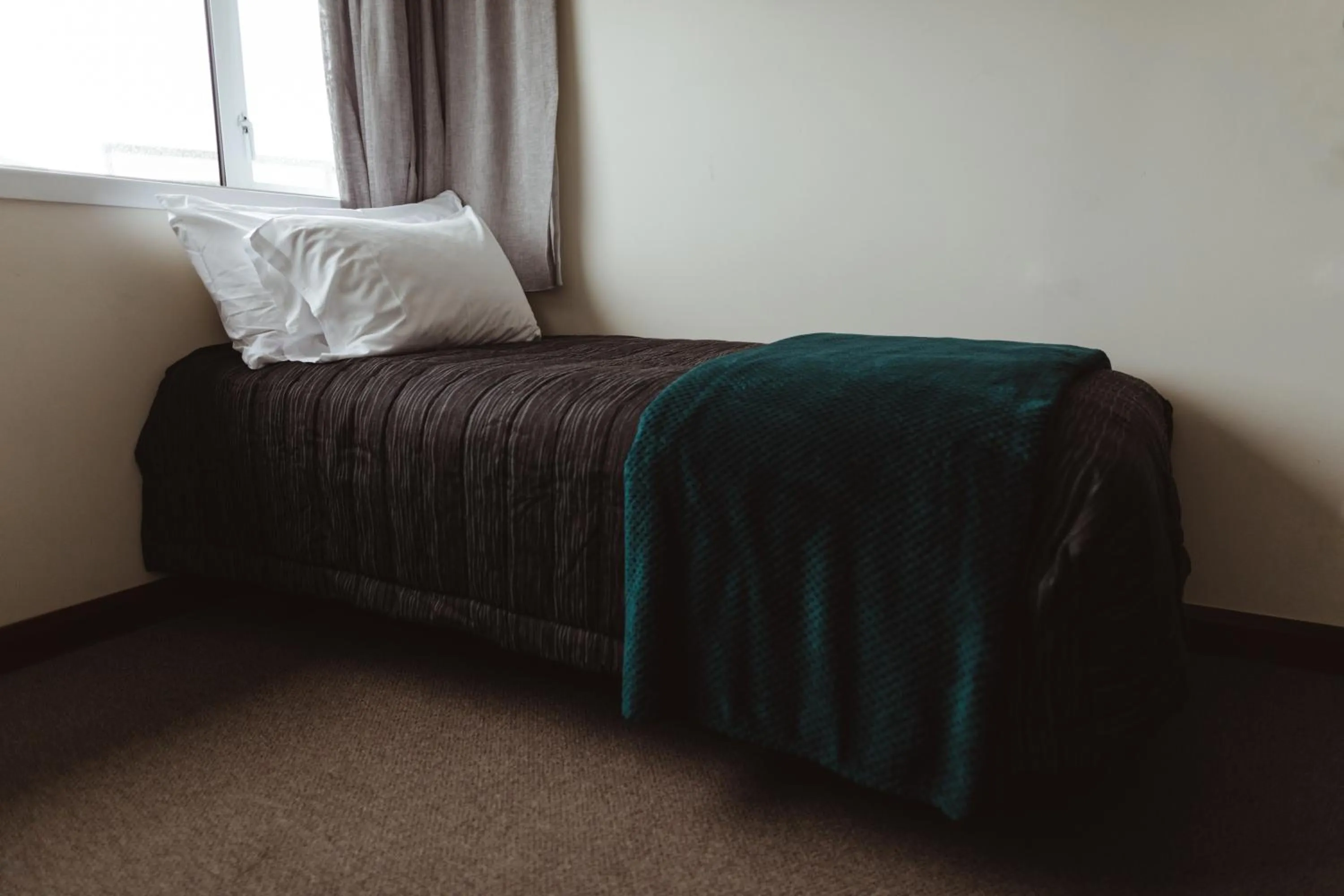 Bed in Makikihi Country Hotel