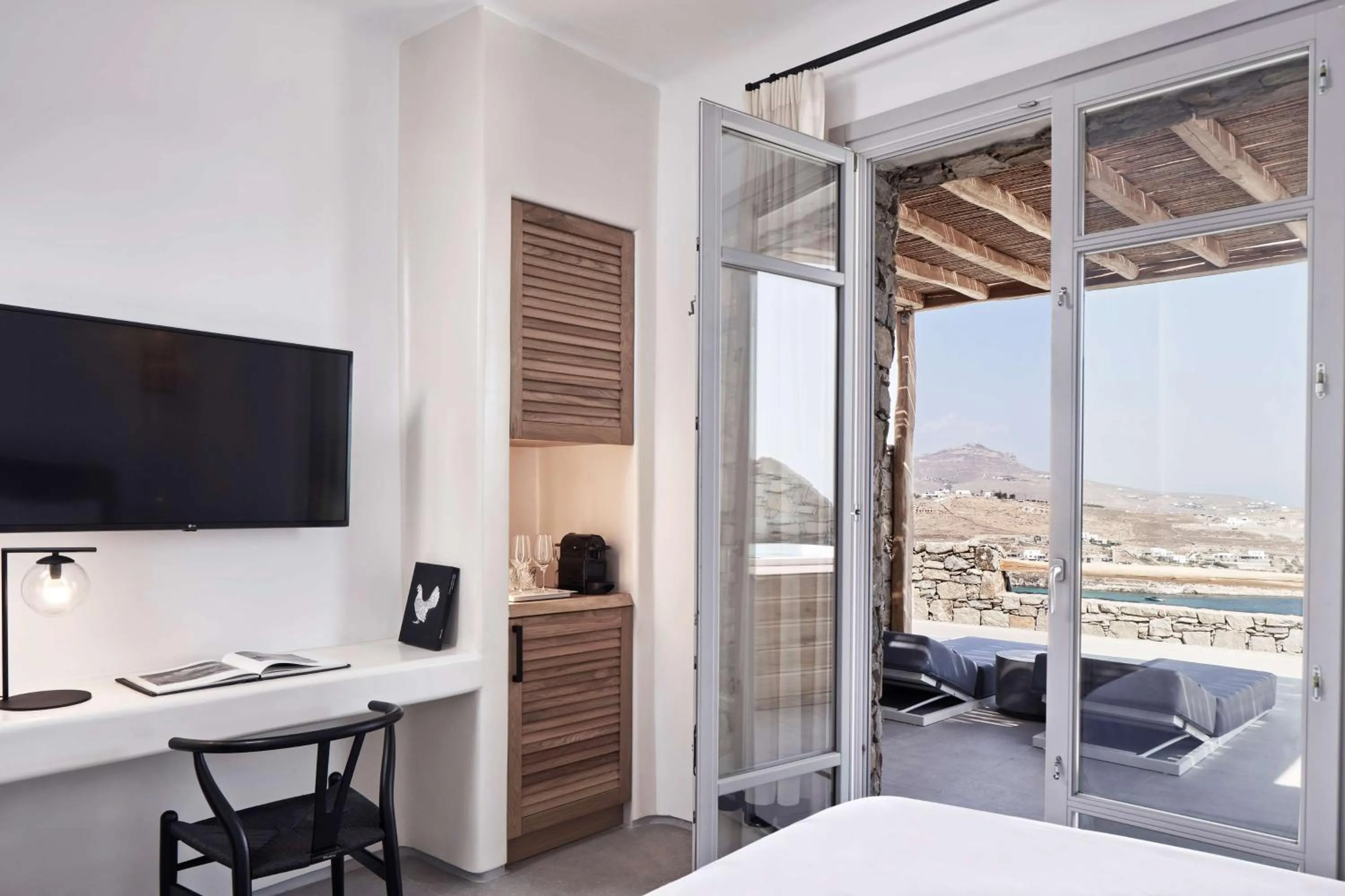 View (from property/room), Bed in Radisson Blu Euphoria Resort, Mykonos