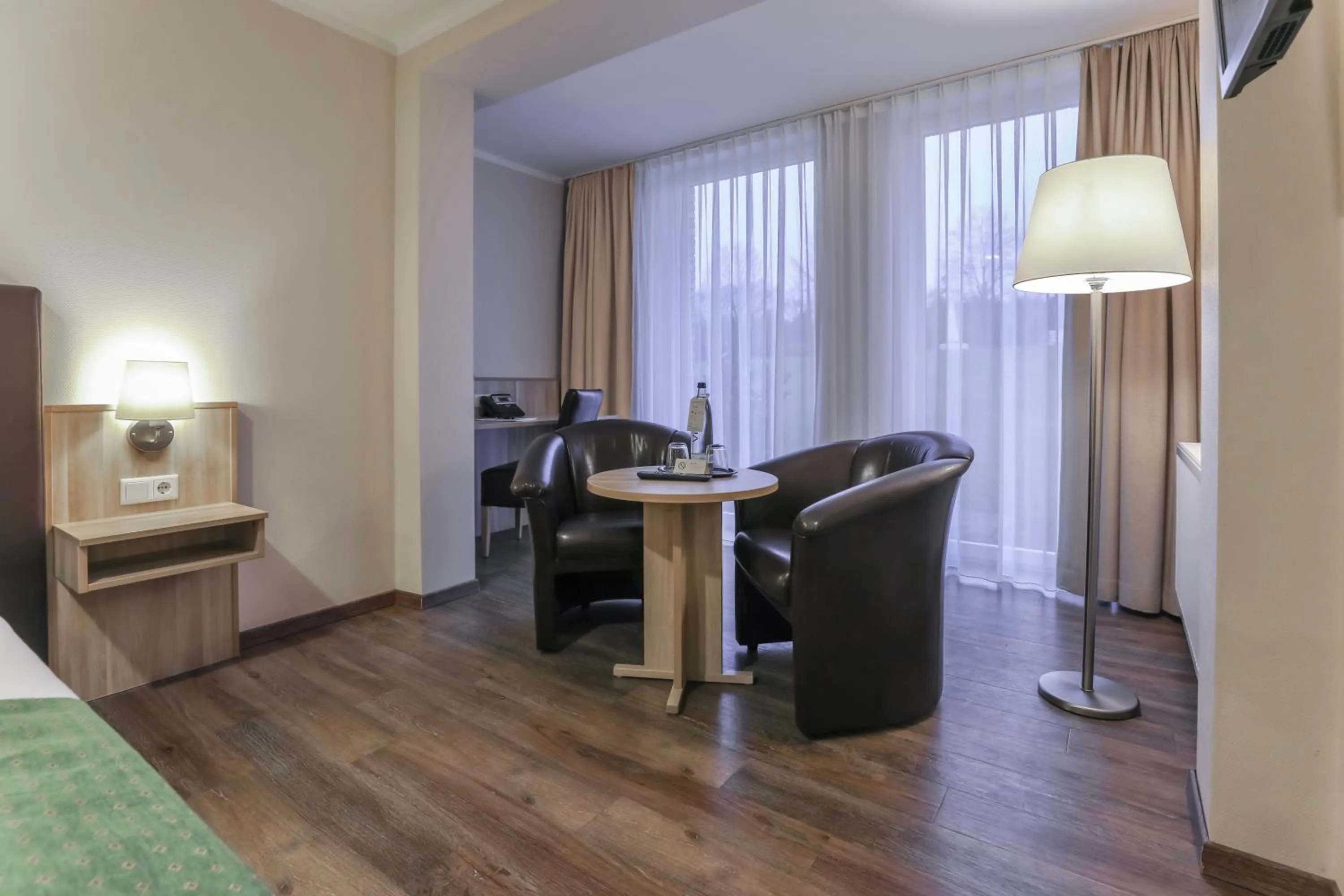 Living room, Bed in Bergmark Hotel