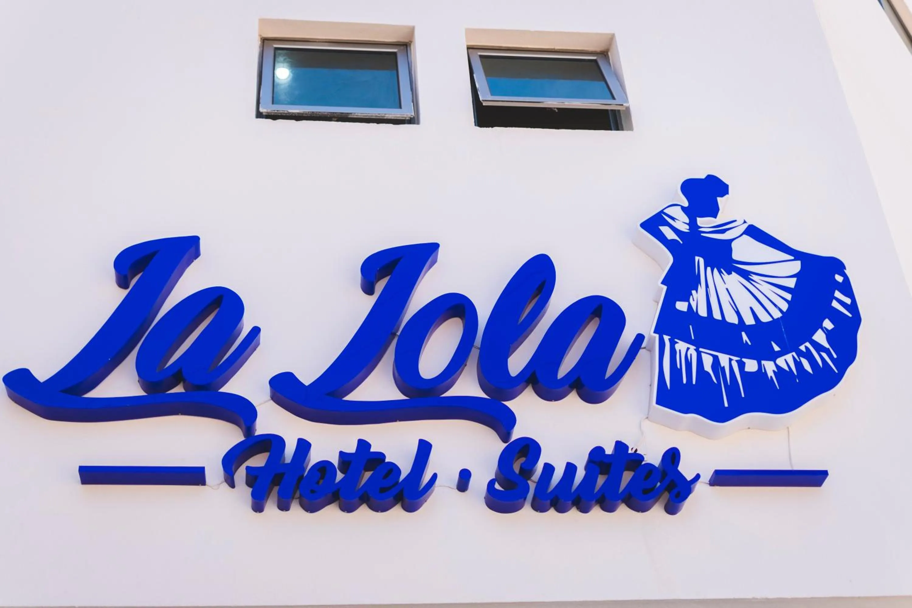 Property logo or sign in La Lola Hotel & Suites
