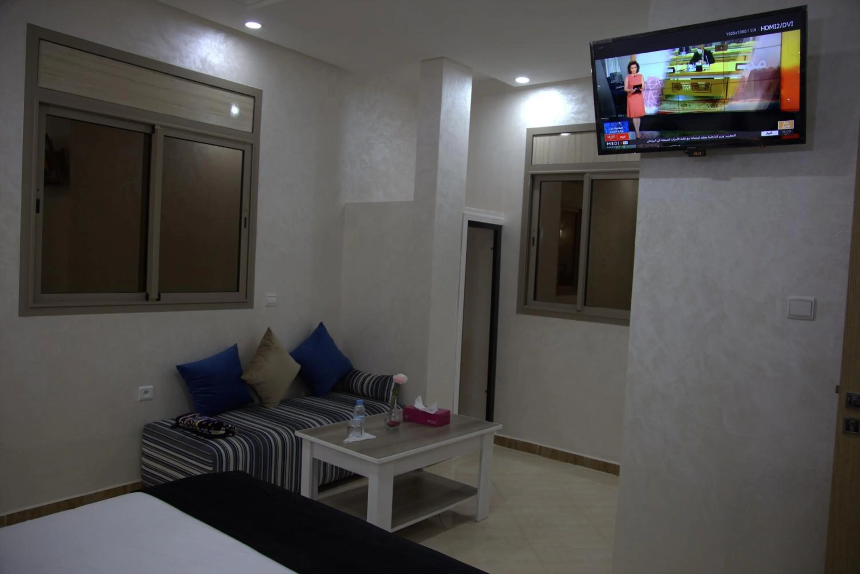 Communal lounge/ TV room, Bed in Dakhla Guest