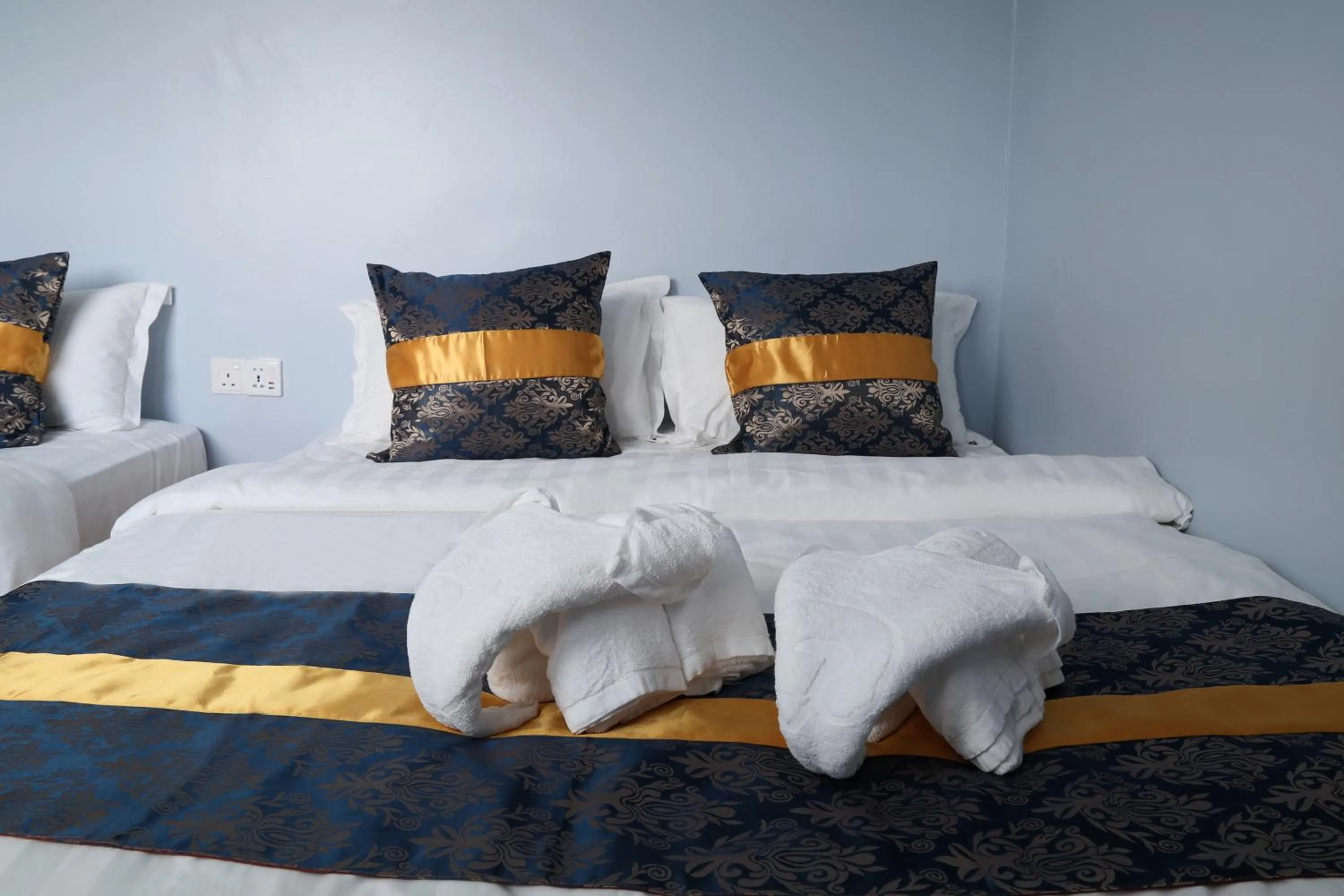 Bed in Top Garden Hotel