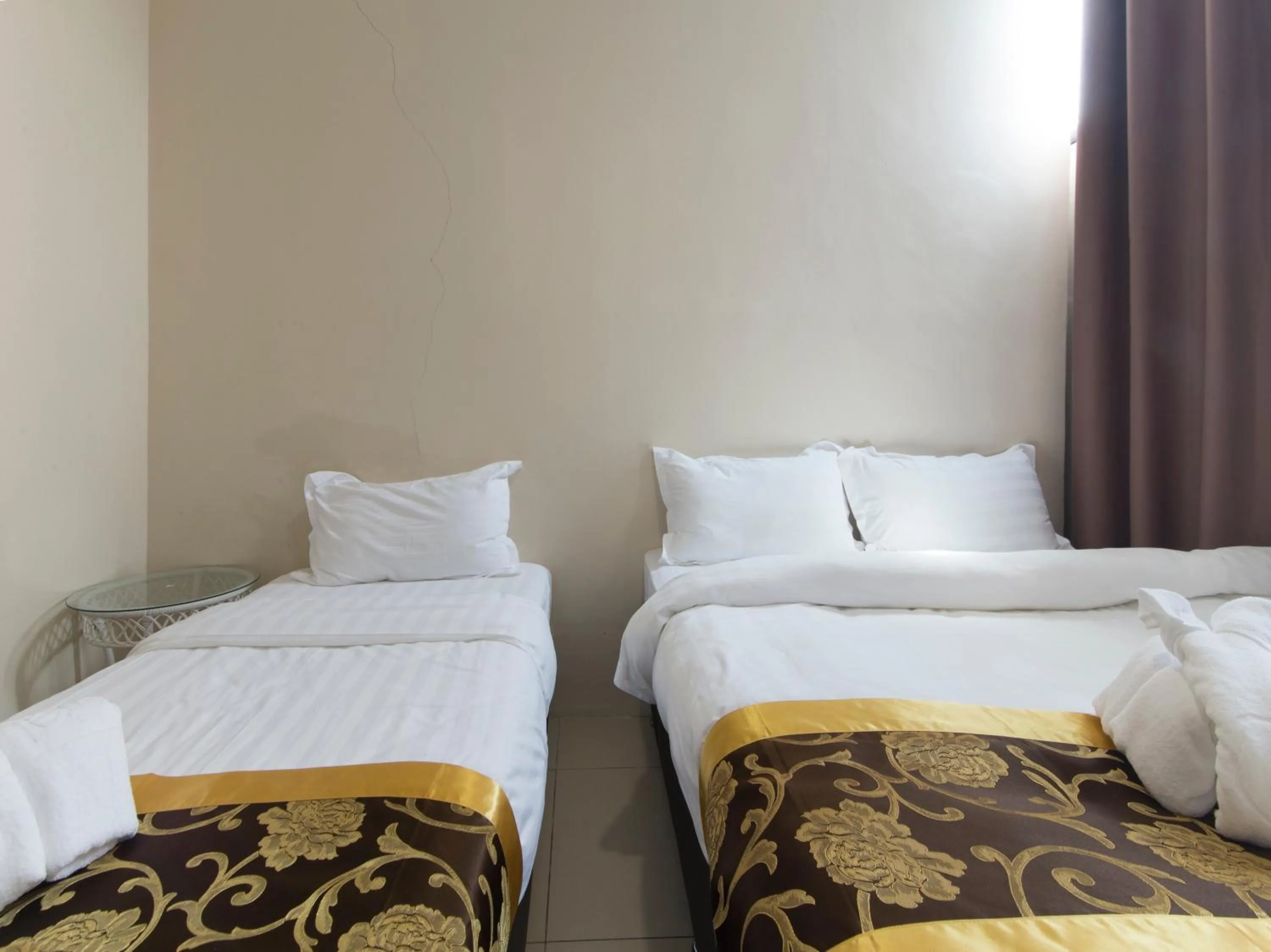 Bed in Top Garden Hotel