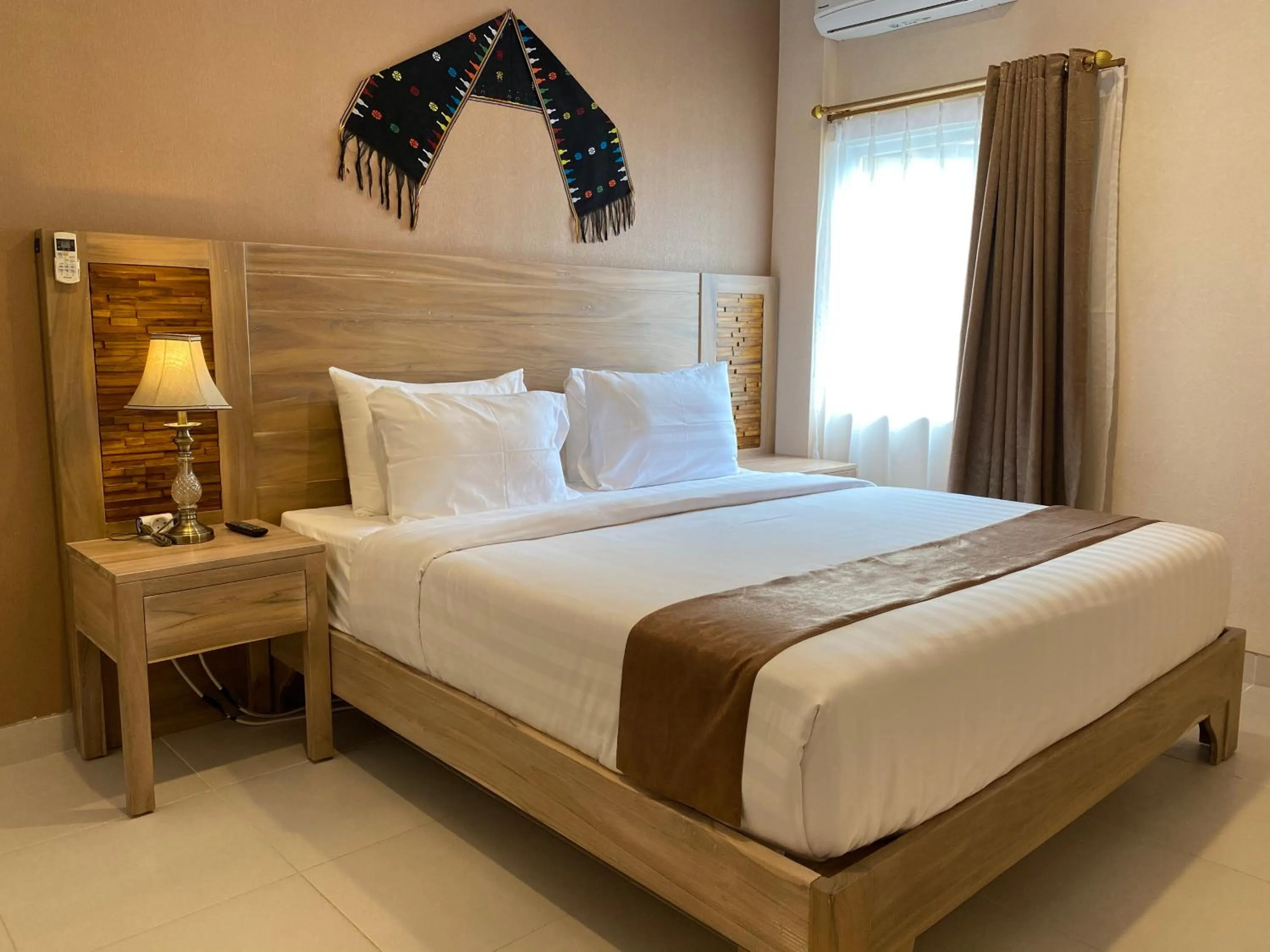 Bed in Flamingo Avia Labuan Bajo