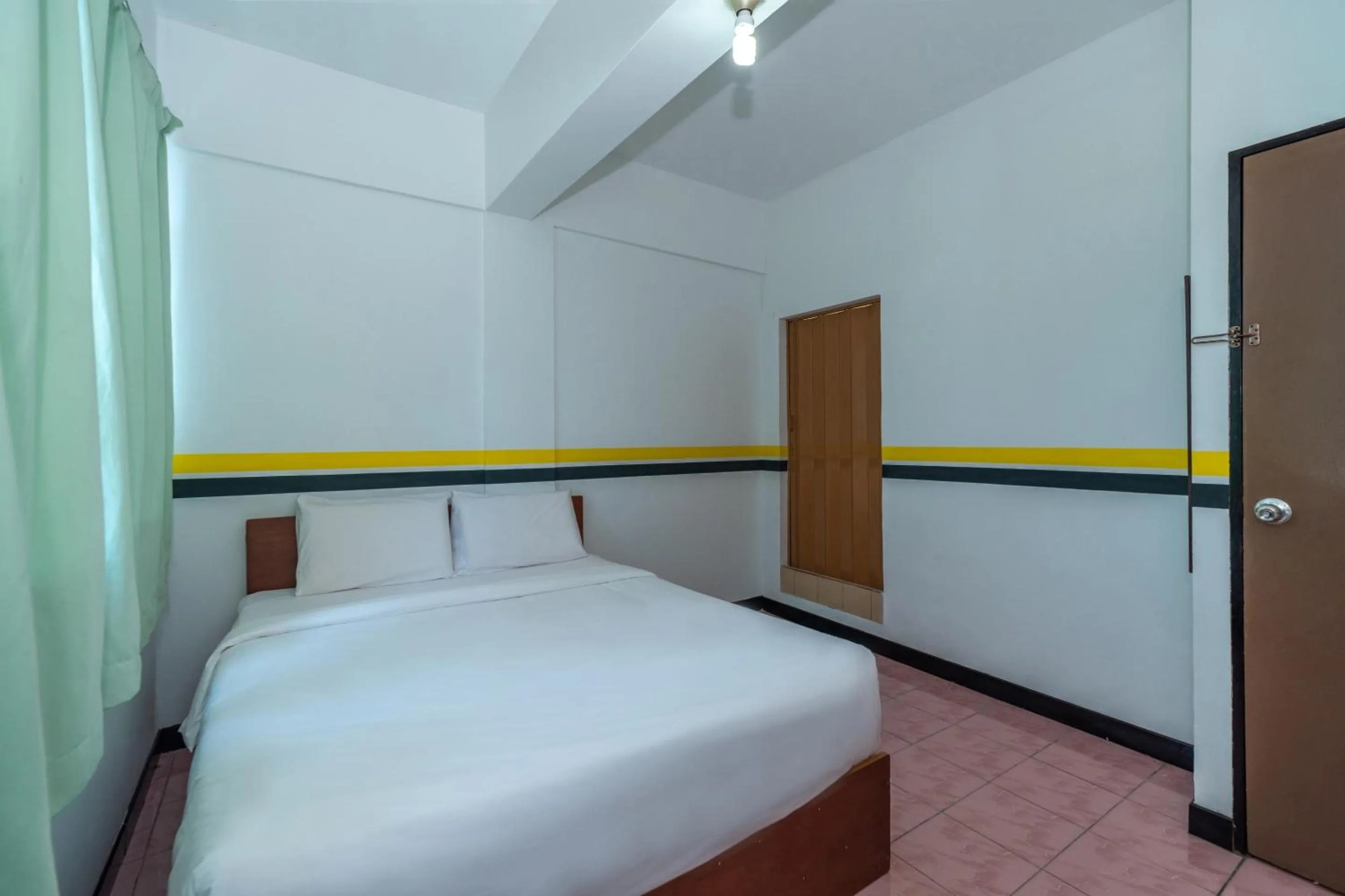 Bedroom in SPOT ON 89936 Sutera Inn