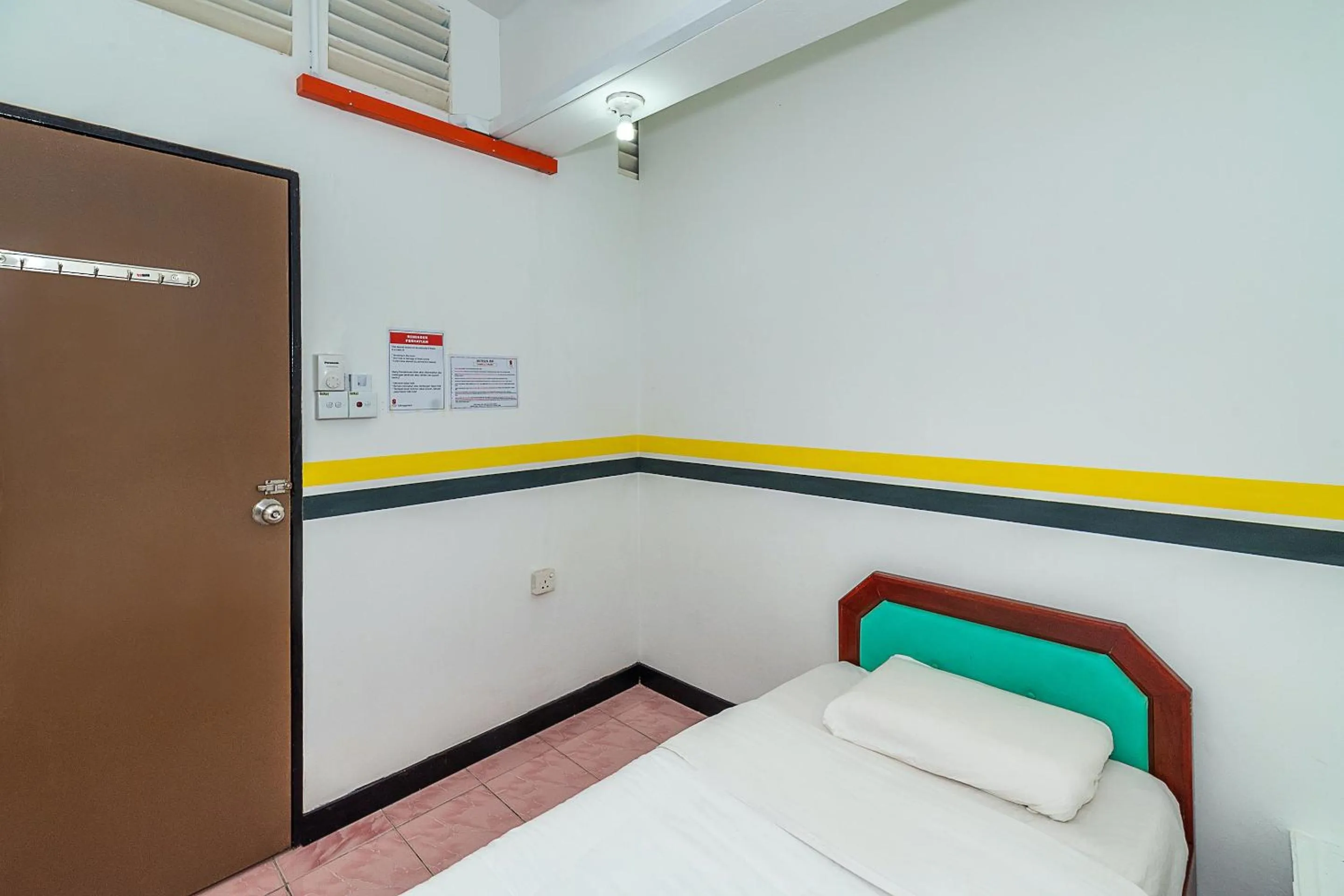 Bedroom in SPOT ON 89936 Sutera Inn