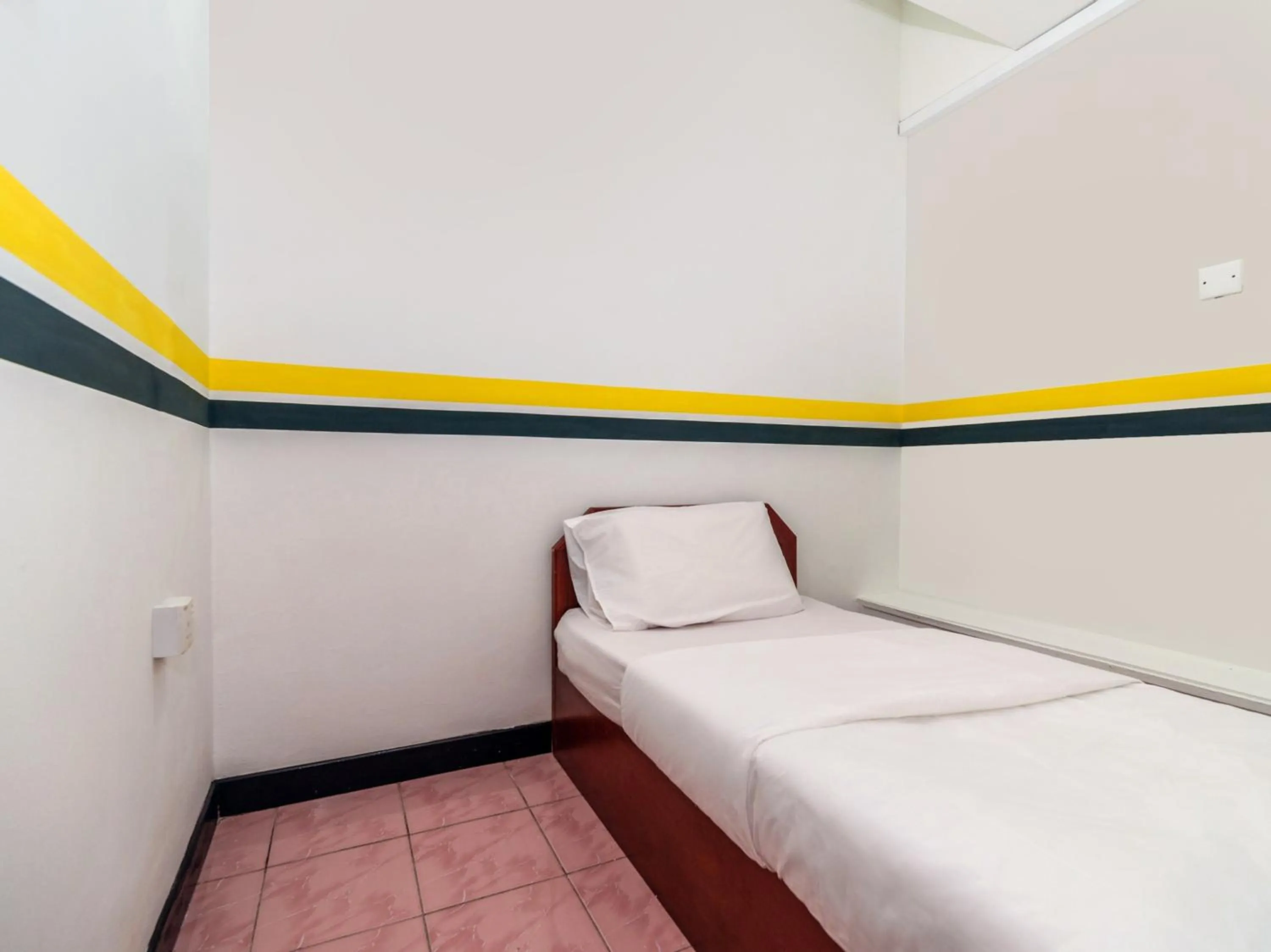 Bedroom in SPOT ON 89936 Sutera Inn