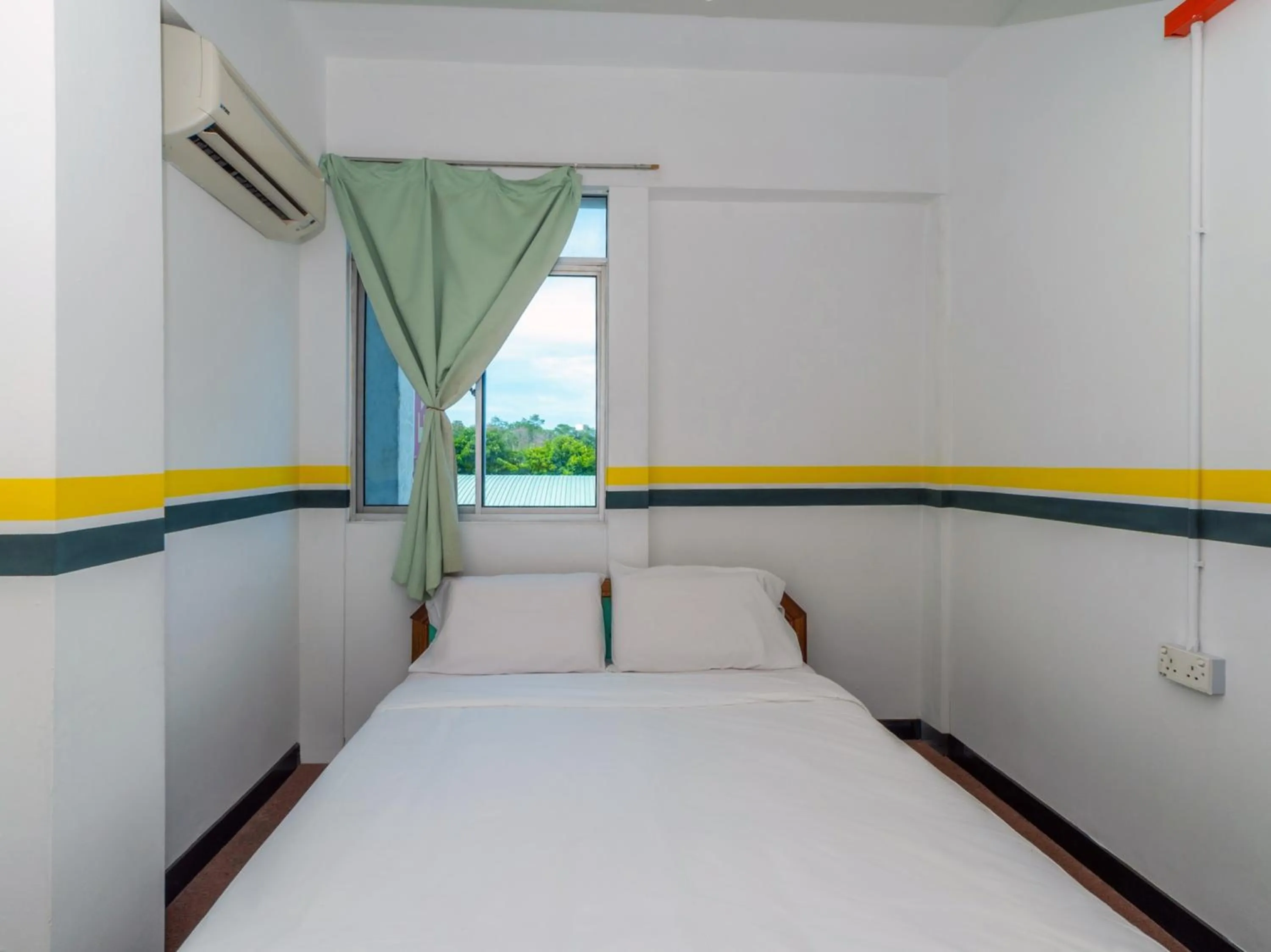 Bedroom in SPOT ON 89936 Sutera Inn