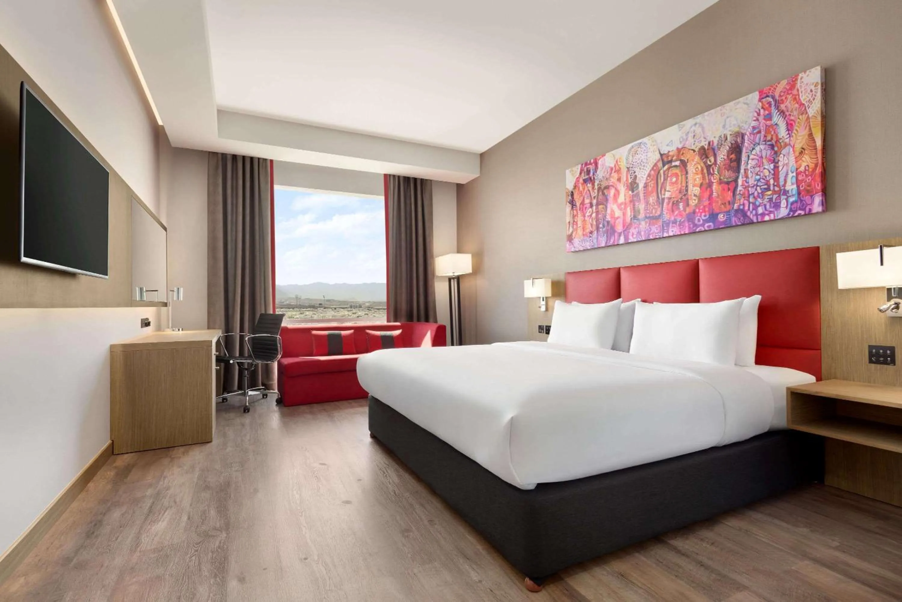 Photo of the whole room, Bed in Ramada Encore by Wyndham Muscat Al-Ghubra