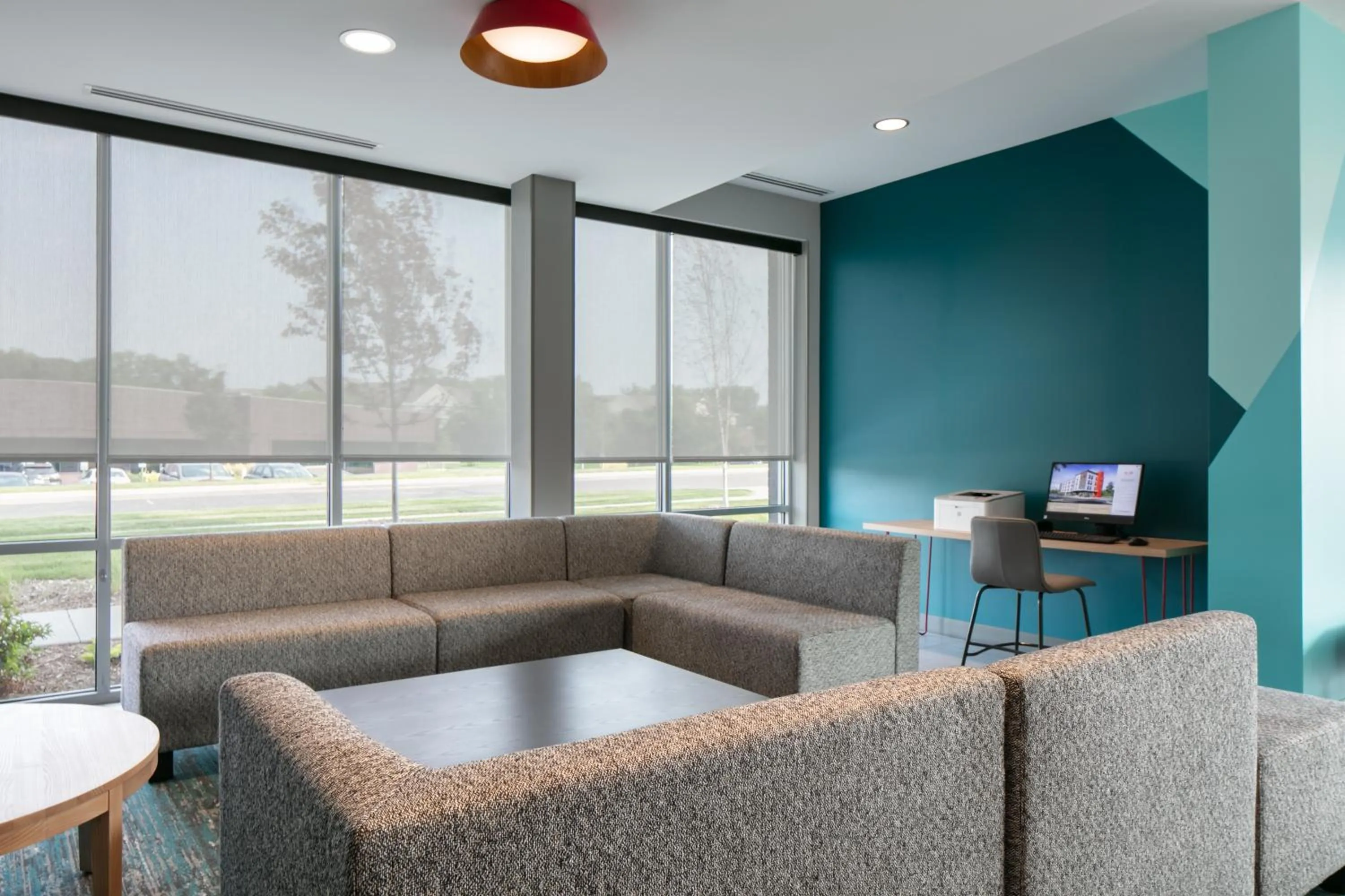 Communal lounge/ TV room in Avid Hotels - Roseville - Minneapolis North by IHG