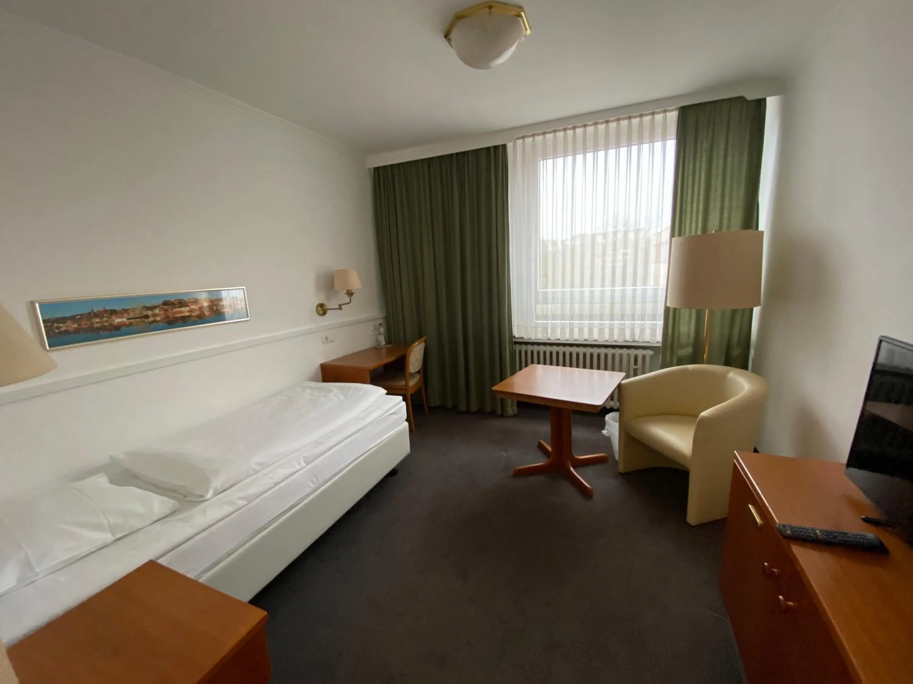 Photo of the whole room, Bed in Hotel Flensburger Hof