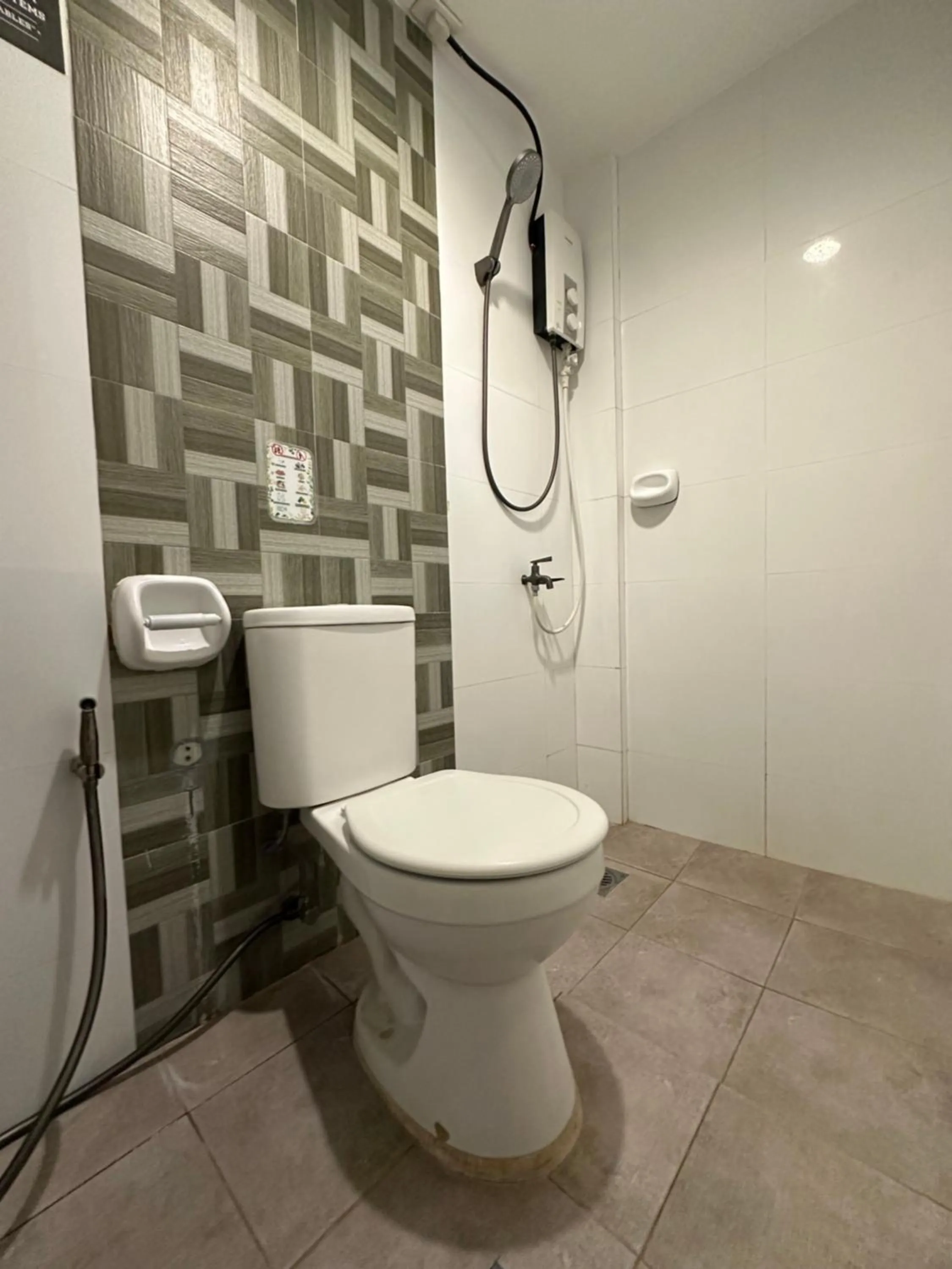 Toilet in S and M Hotel Inc.