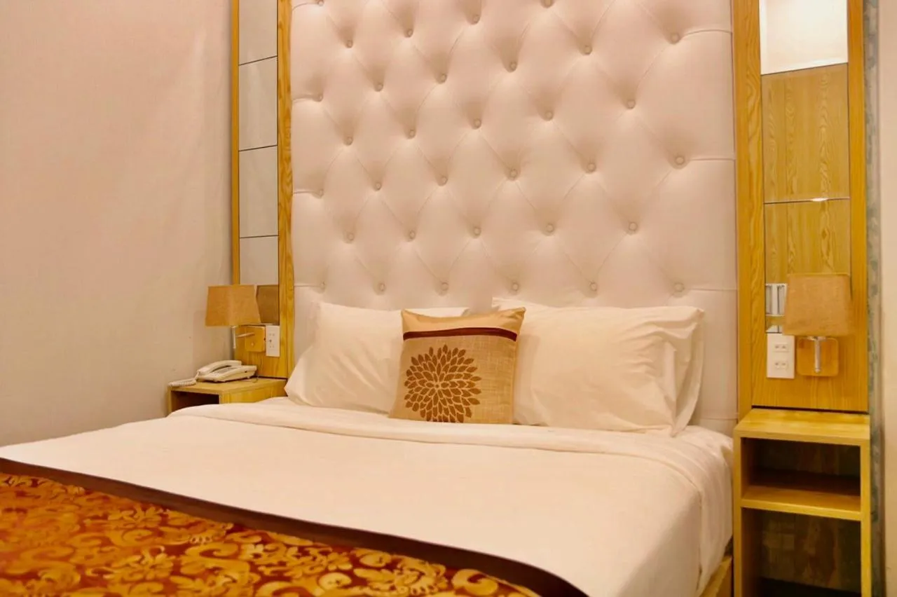 Bed in EMERALD OCEAN HOTEL