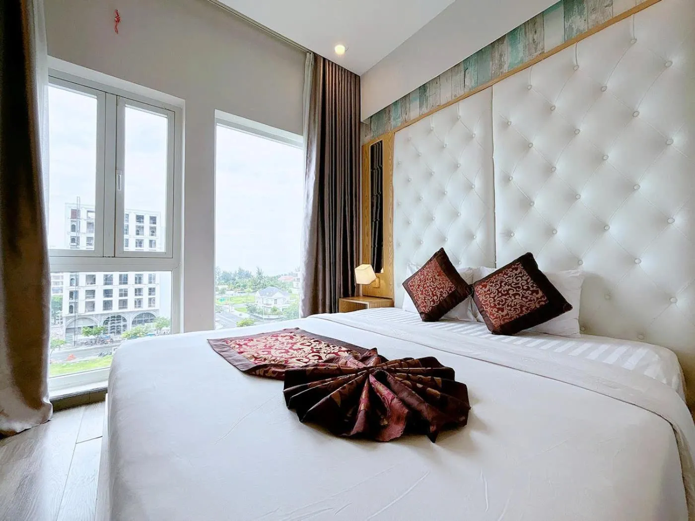 Bed in EMERALD OCEAN HOTEL