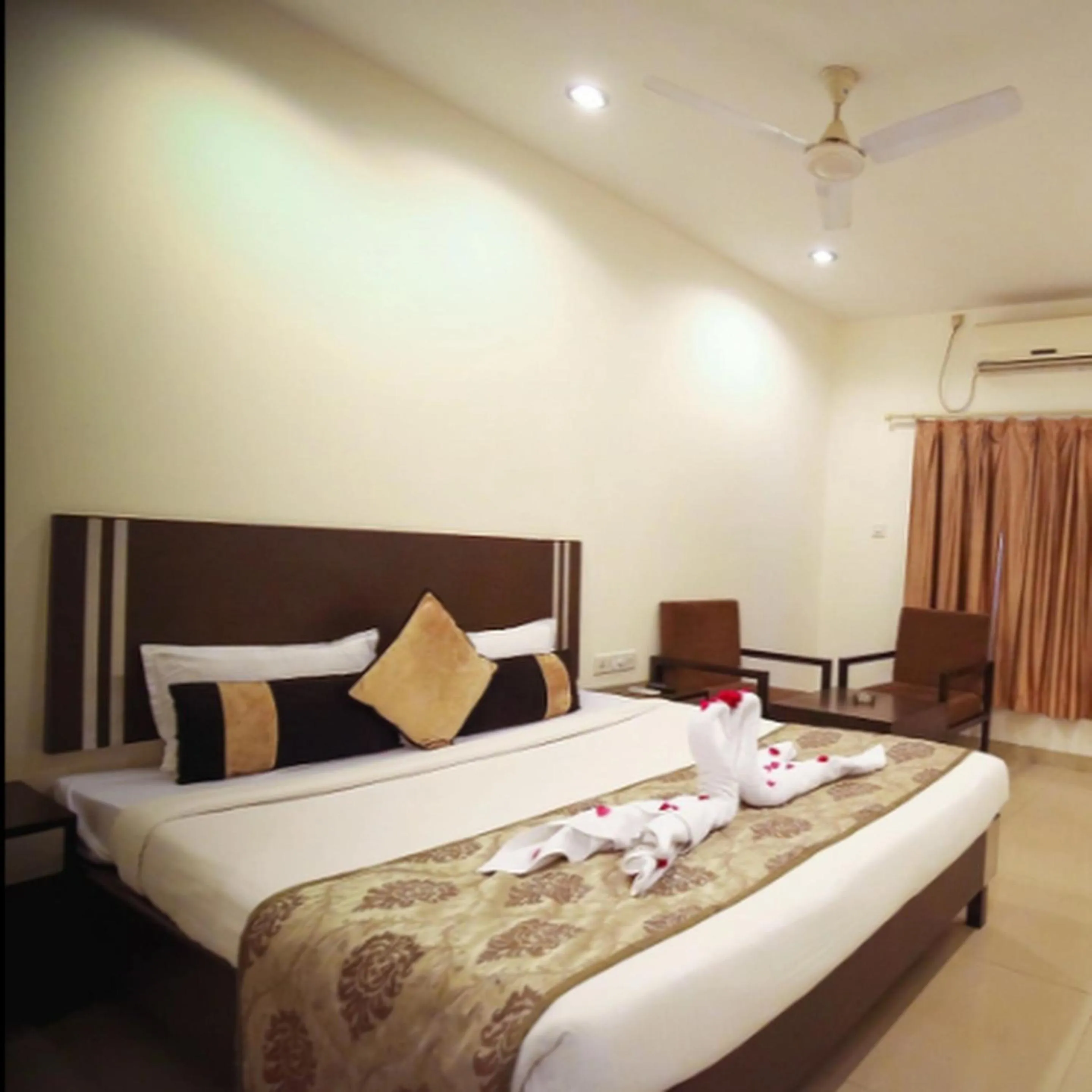 Bed in Regency Square Hotel