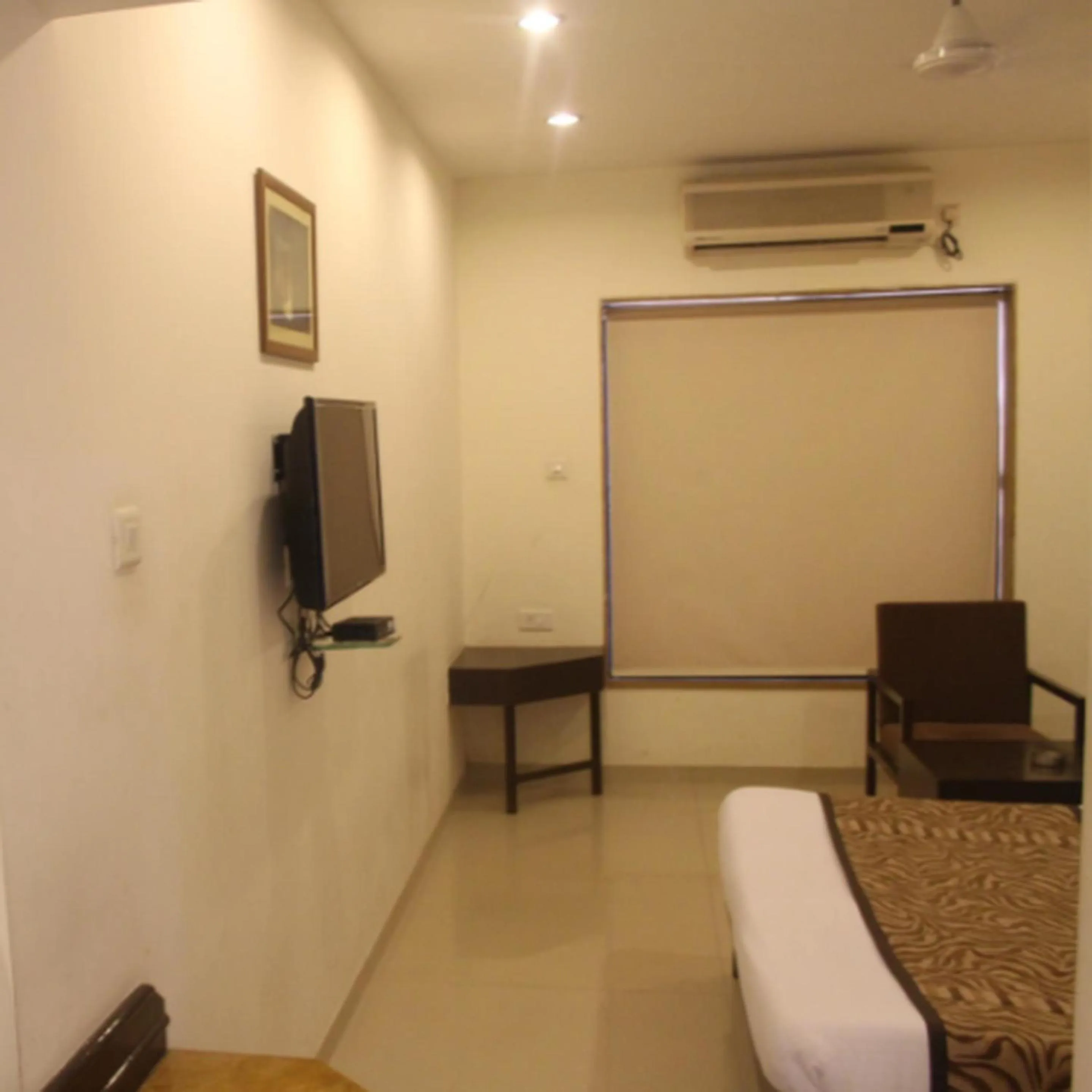 Bed in Regency Square Hotel