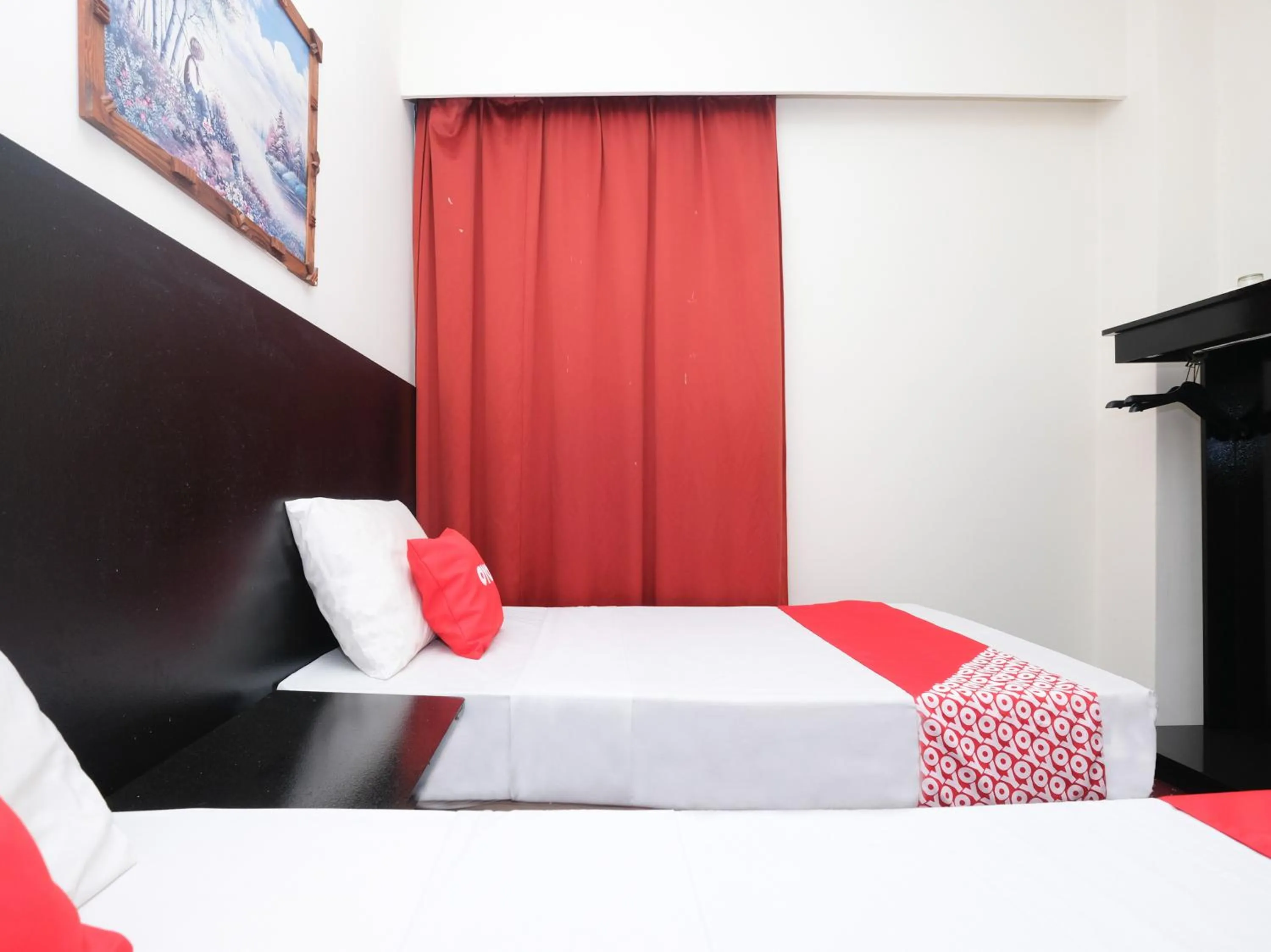 Bedroom in OYO 89968 Sri Sutra Hotel